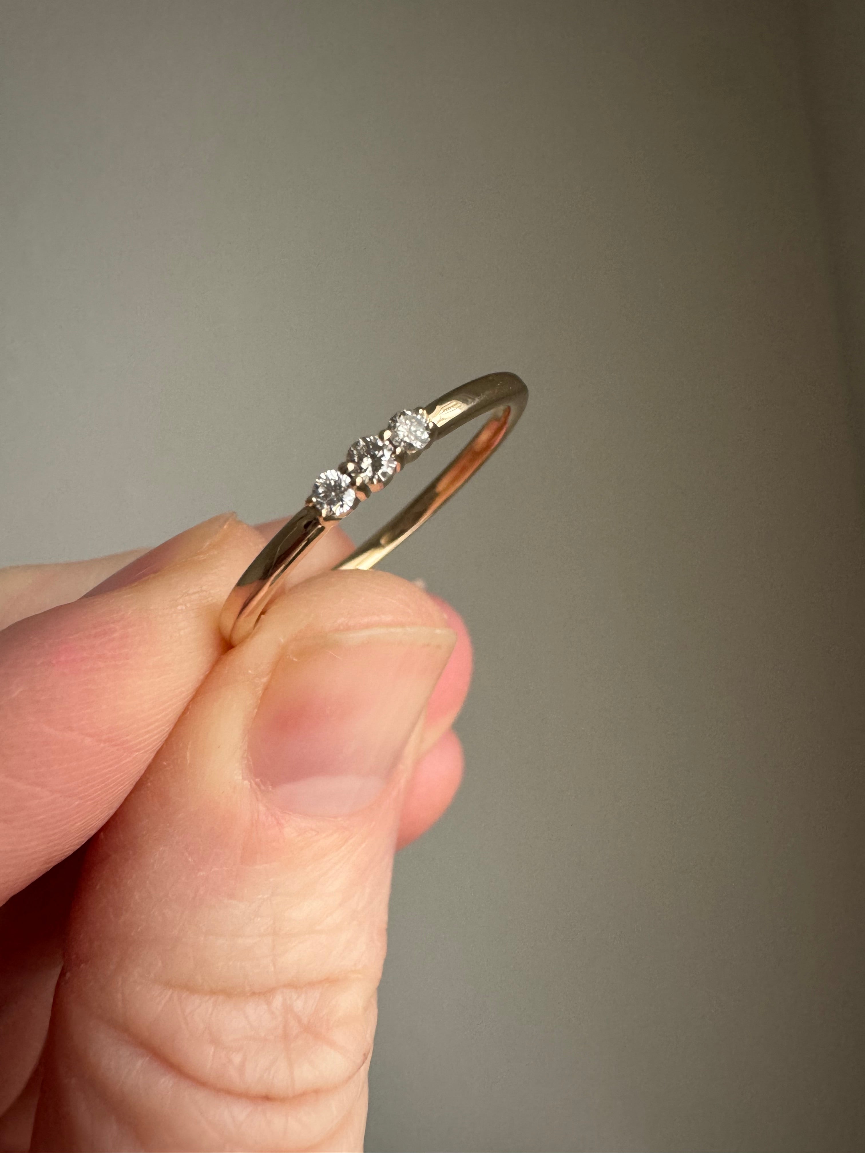 Custom 10k yellow gold 3 stone ring using customer's 2, 1.95 mm round diamonds and 1, 2mm round diamond. Size 8.25