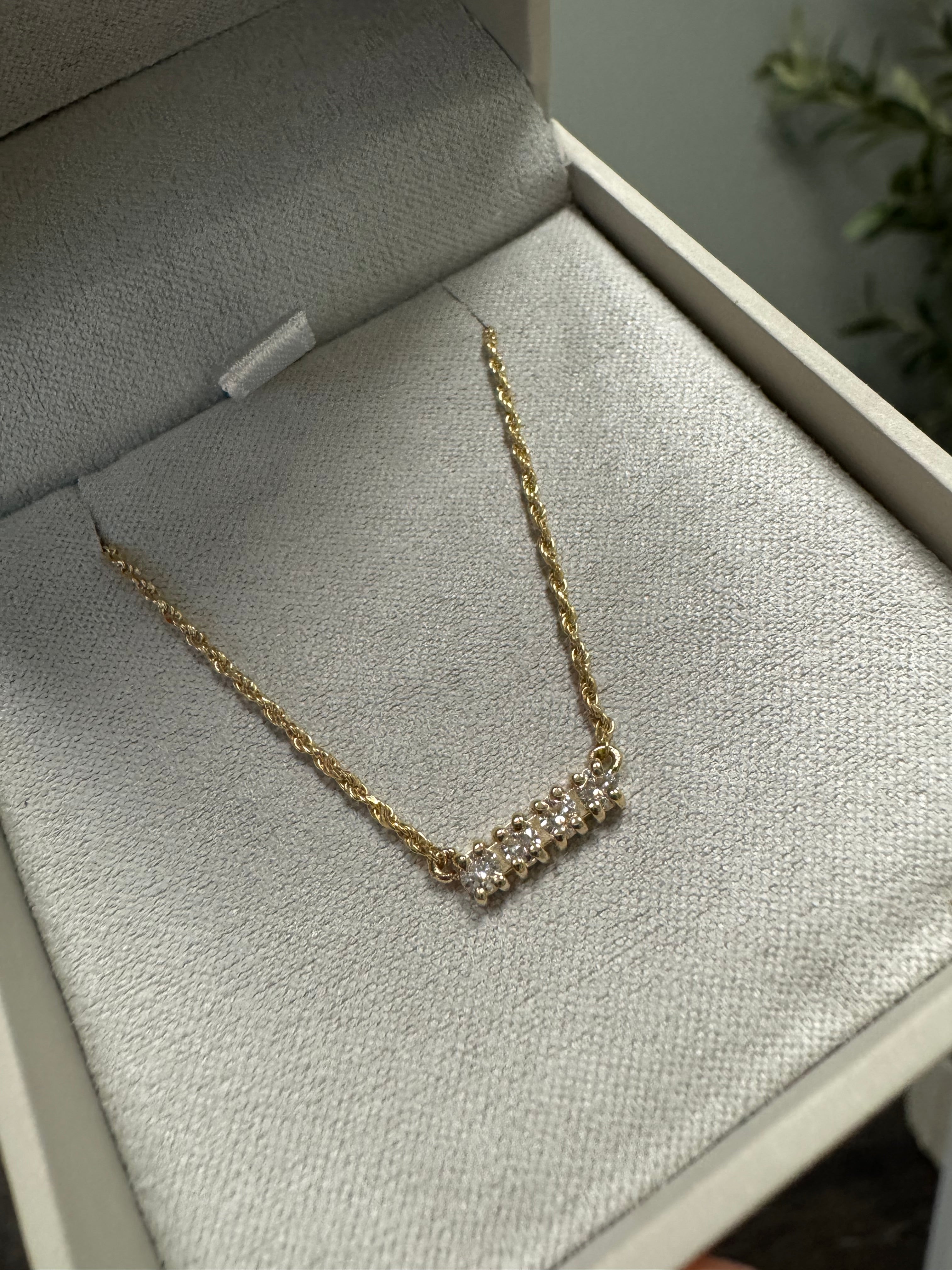 10k yellow gold diamond bar necklace using customer's 4, 2.3mm round diamonds on a 1.15mm rope chain. 21"