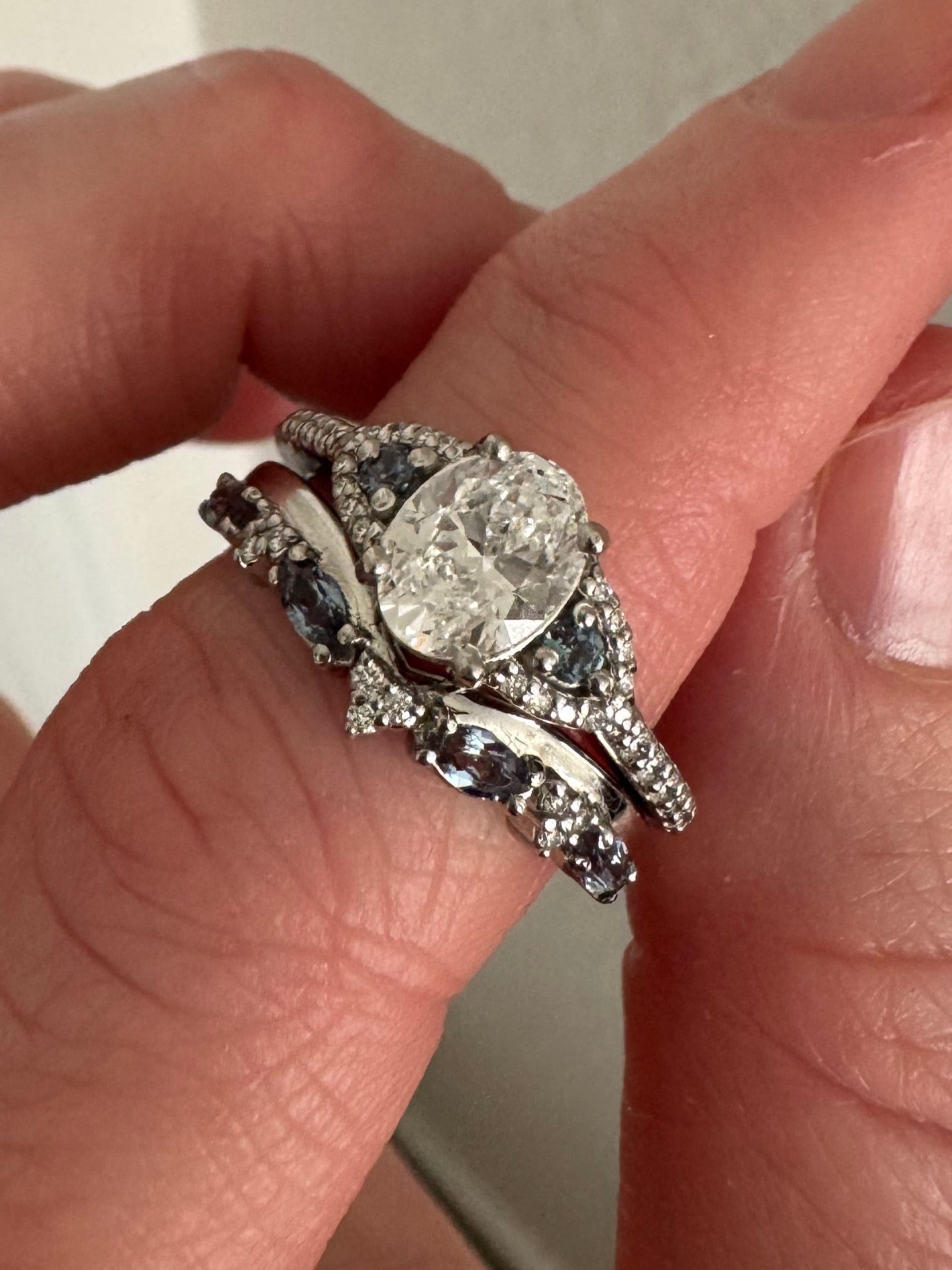 Replace opals with lab grown alexandrite (2, 2mm round & 4, 4x2mm marquise) in customer's platinum diamond engagement ring. Charge COST on stones. Not charging for labor & shipping.