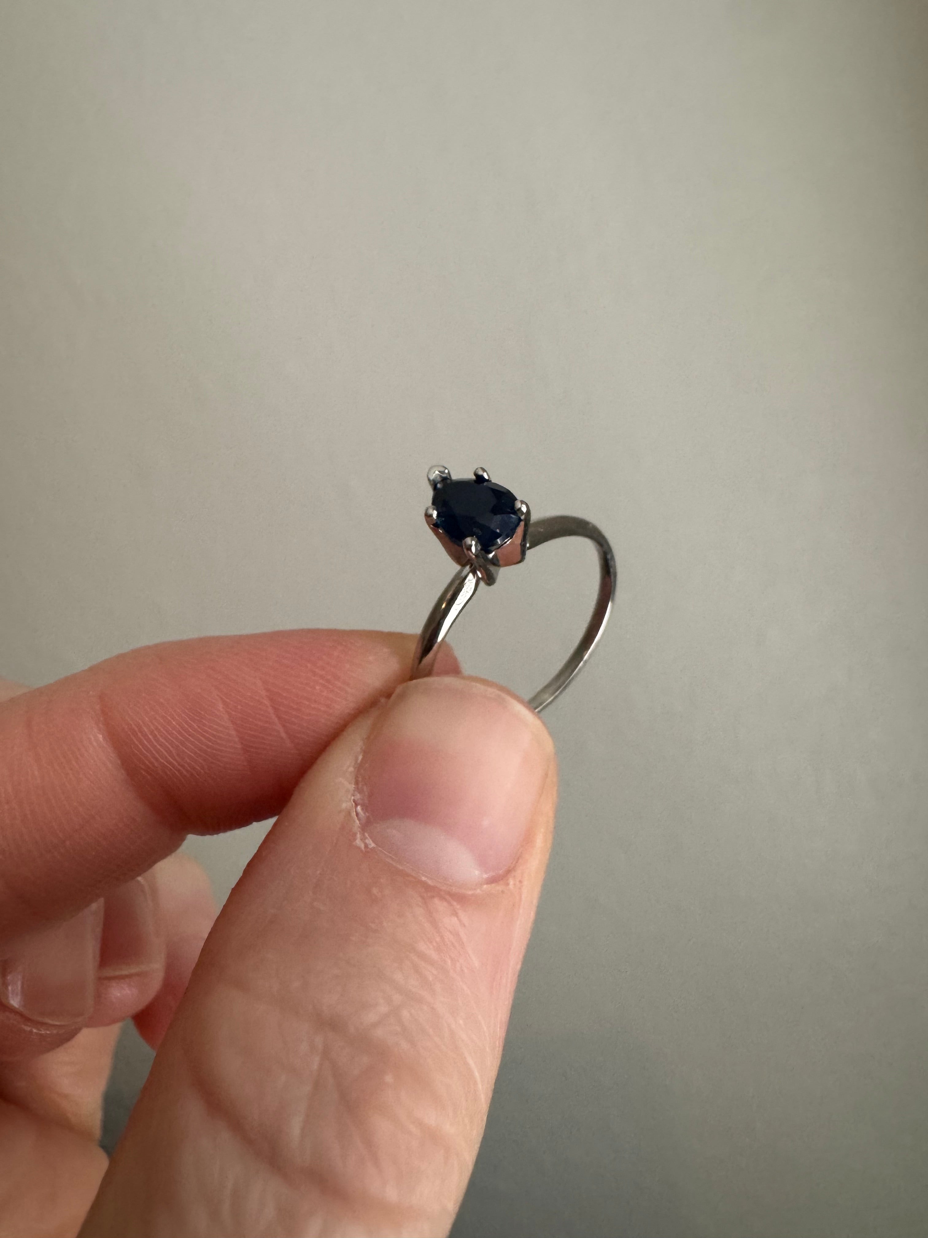 Set customer's lab grown pear shaped blue sapphire (7x5mm) in 14k white gold solitaire setting. Size 7.
