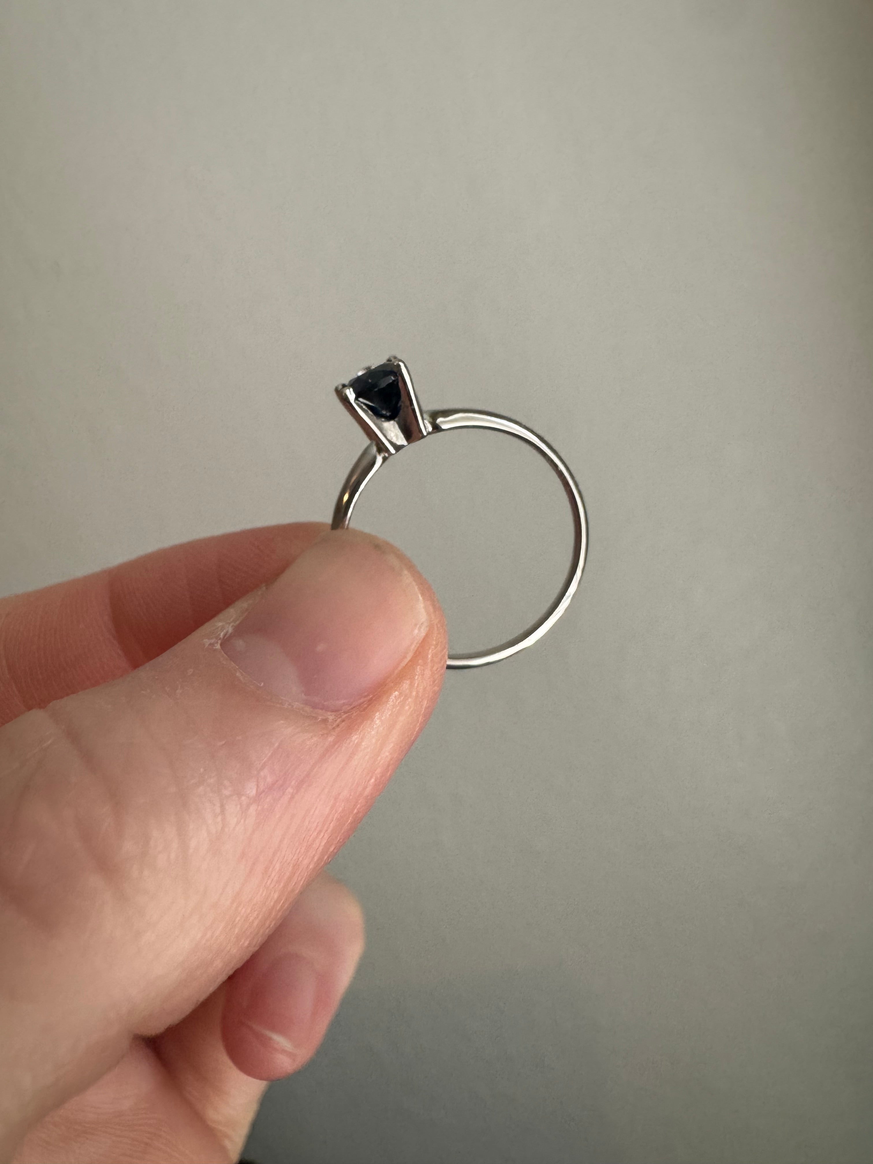 Set customer's lab grown pear shaped blue sapphire (7x5mm) in 14k white gold solitaire setting. Size 7.