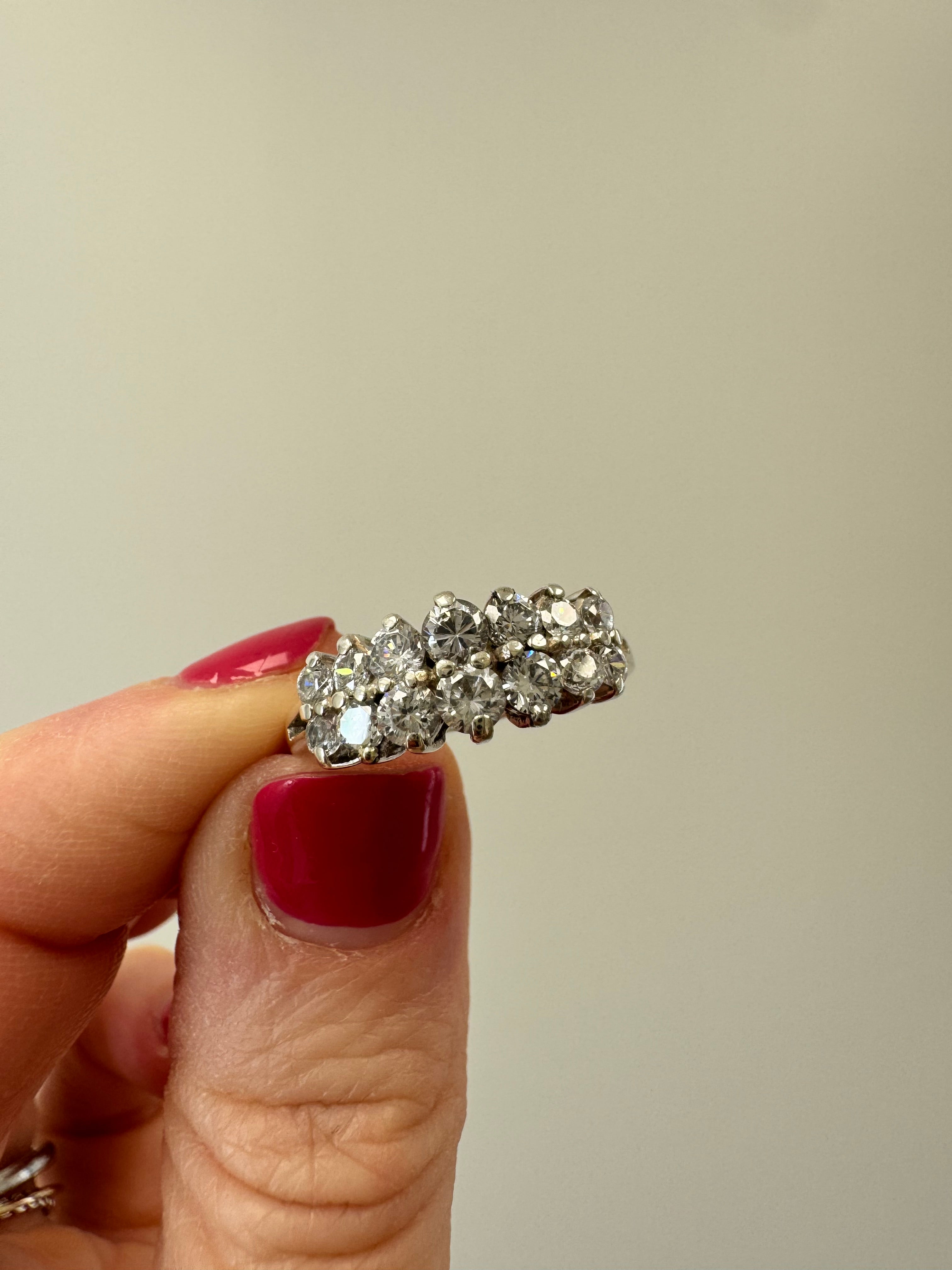 Replace missing CZ (use CZ from other ring provided by client). Retip this CZ & 1 other (3 over from missing one). Round out & polish.