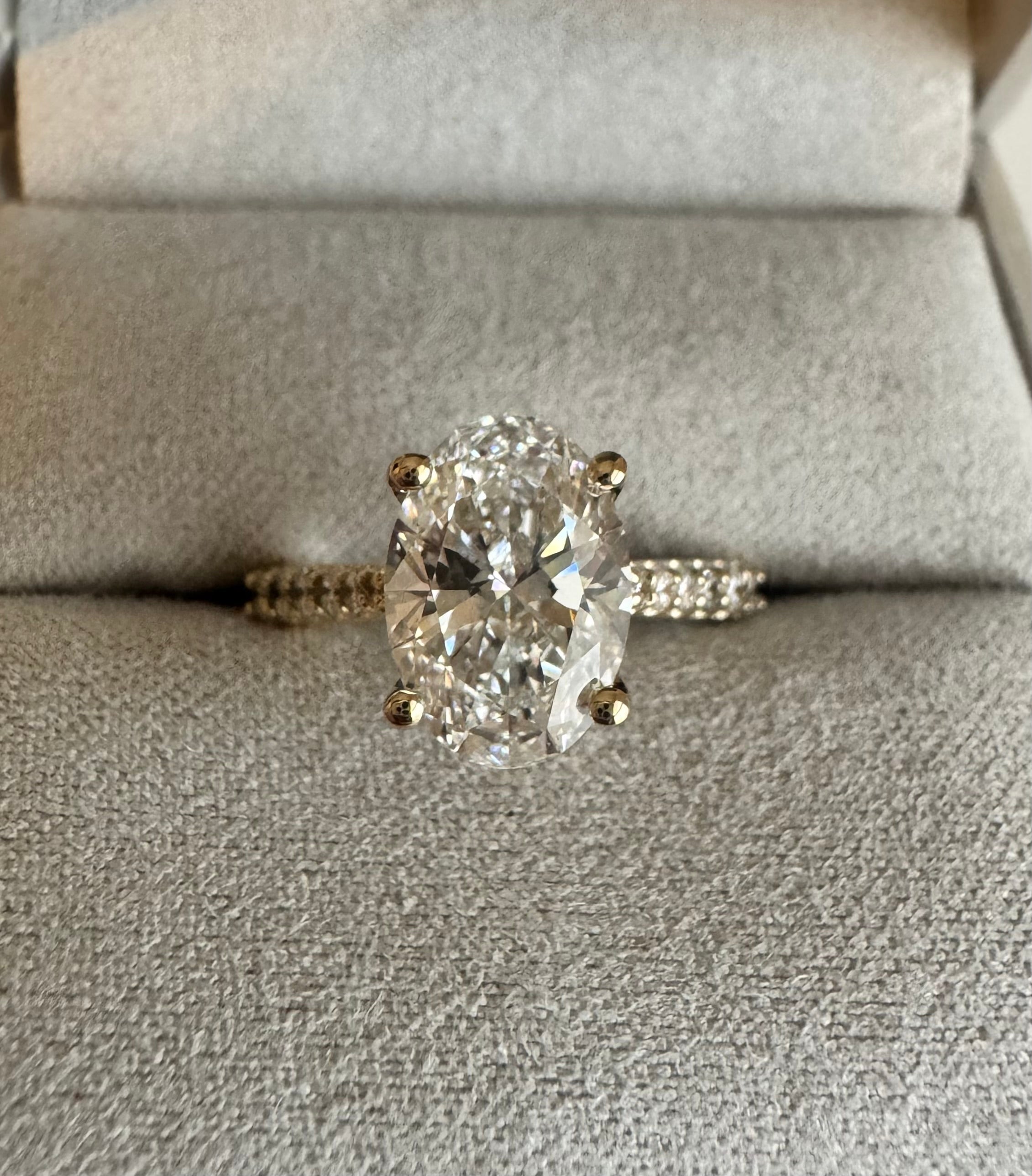 Custom 14k yellow gold lab grown diamond engagement ring. Center diamond= 2.52 ct lab grown oval (D, VS2). Size 6.