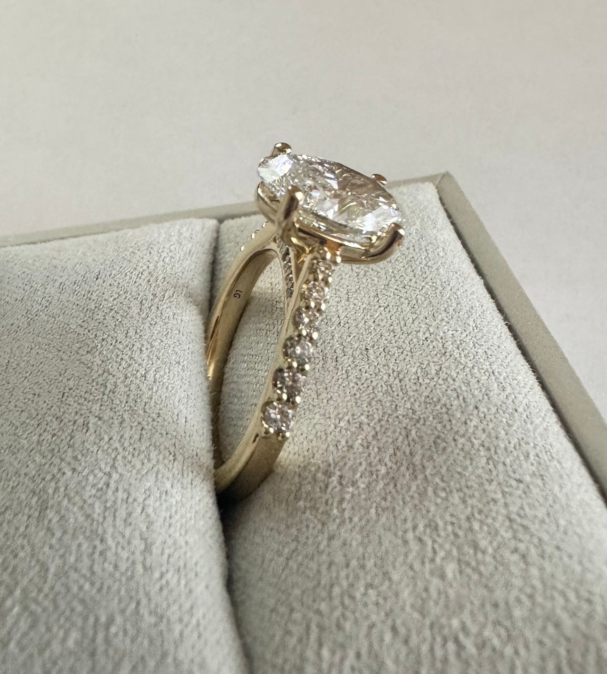 Custom 14k yellow gold lab grown diamond engagement ring. Center diamond= 2.52 ct lab grown oval (D, VS2). Size 6.