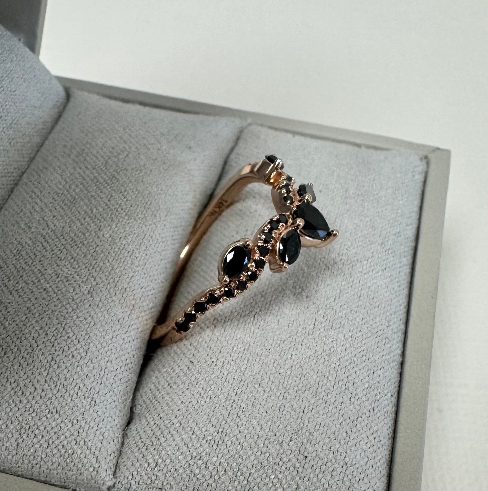 Custom 14k rose gold black diamond curved wedding band. Size 7. Total approximate carat weight= 0.53 carats.