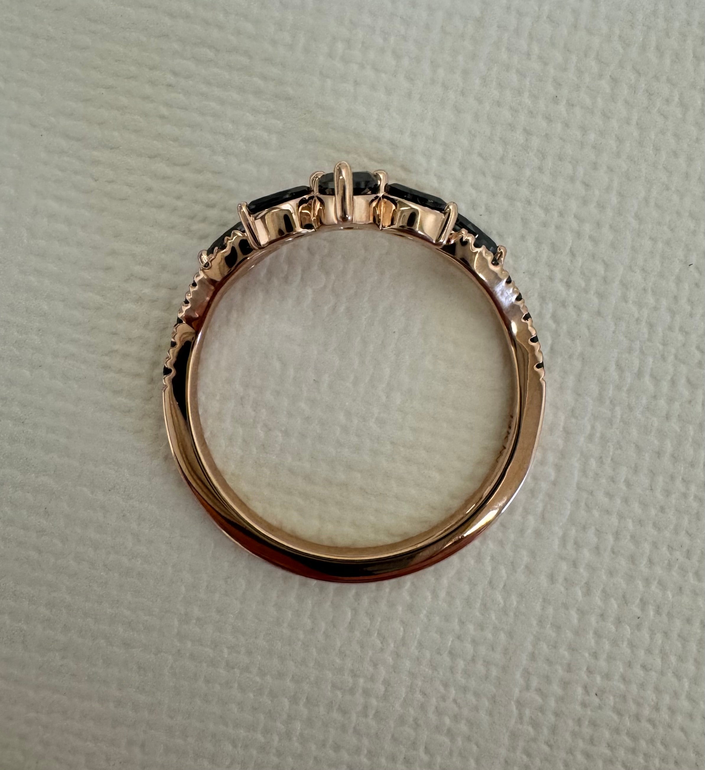 Custom 14k rose gold black diamond curved wedding band. Size 7. Total approximate carat weight= 0.53 carats.