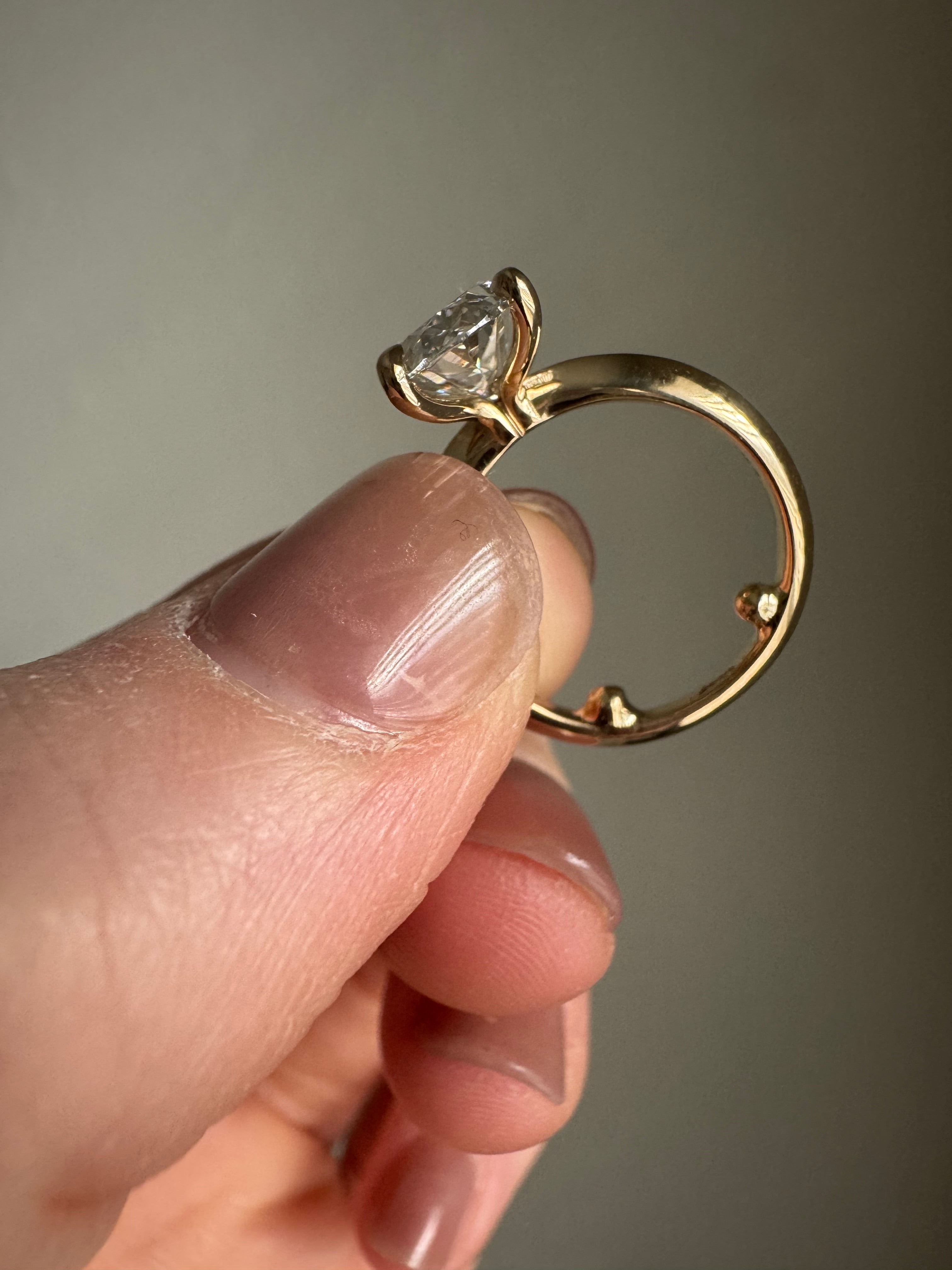 Add sizing beads to inside of 14k yellow gold engagement ring & tighten stone