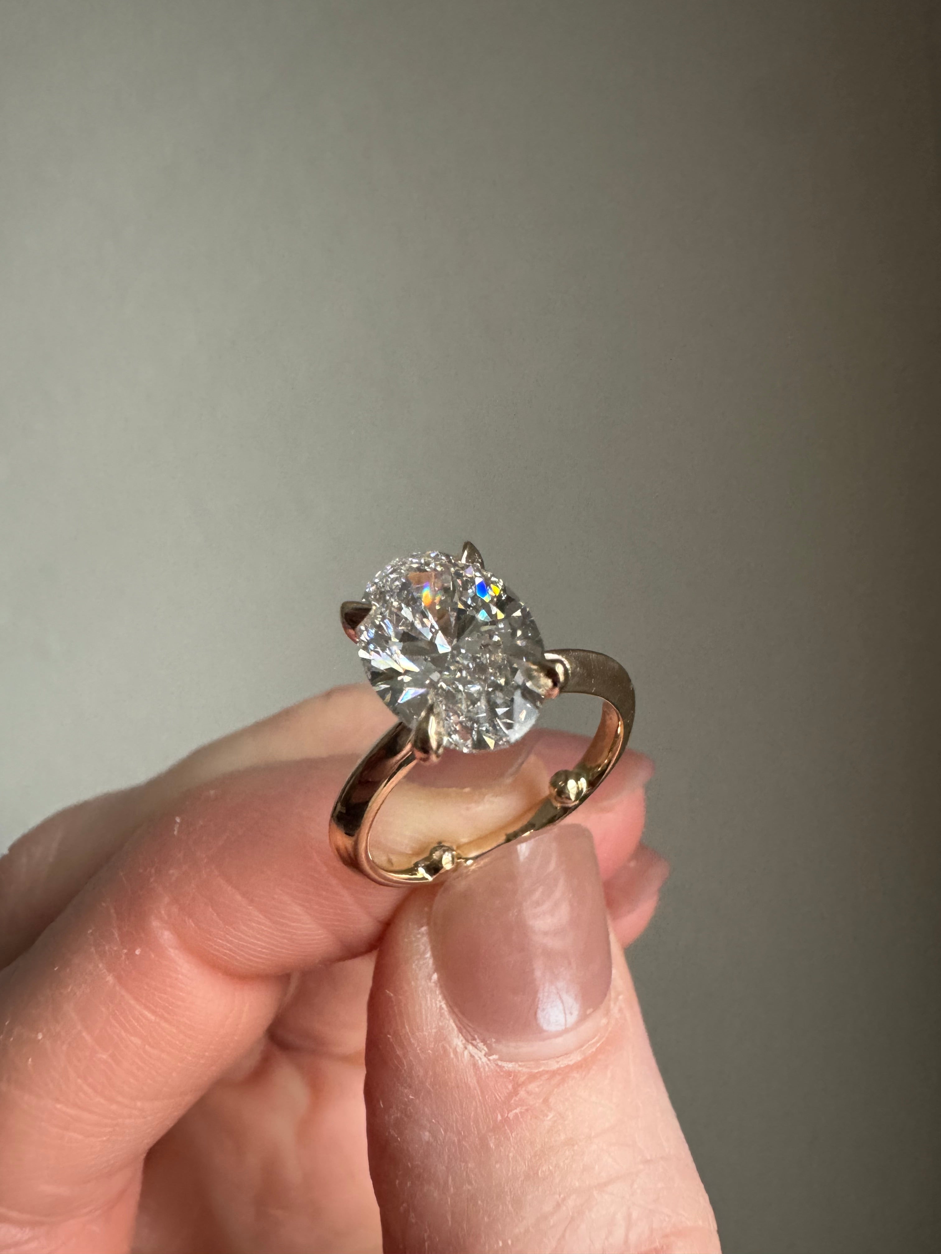 Add sizing beads to inside of 14k yellow gold engagement ring & tighten stone