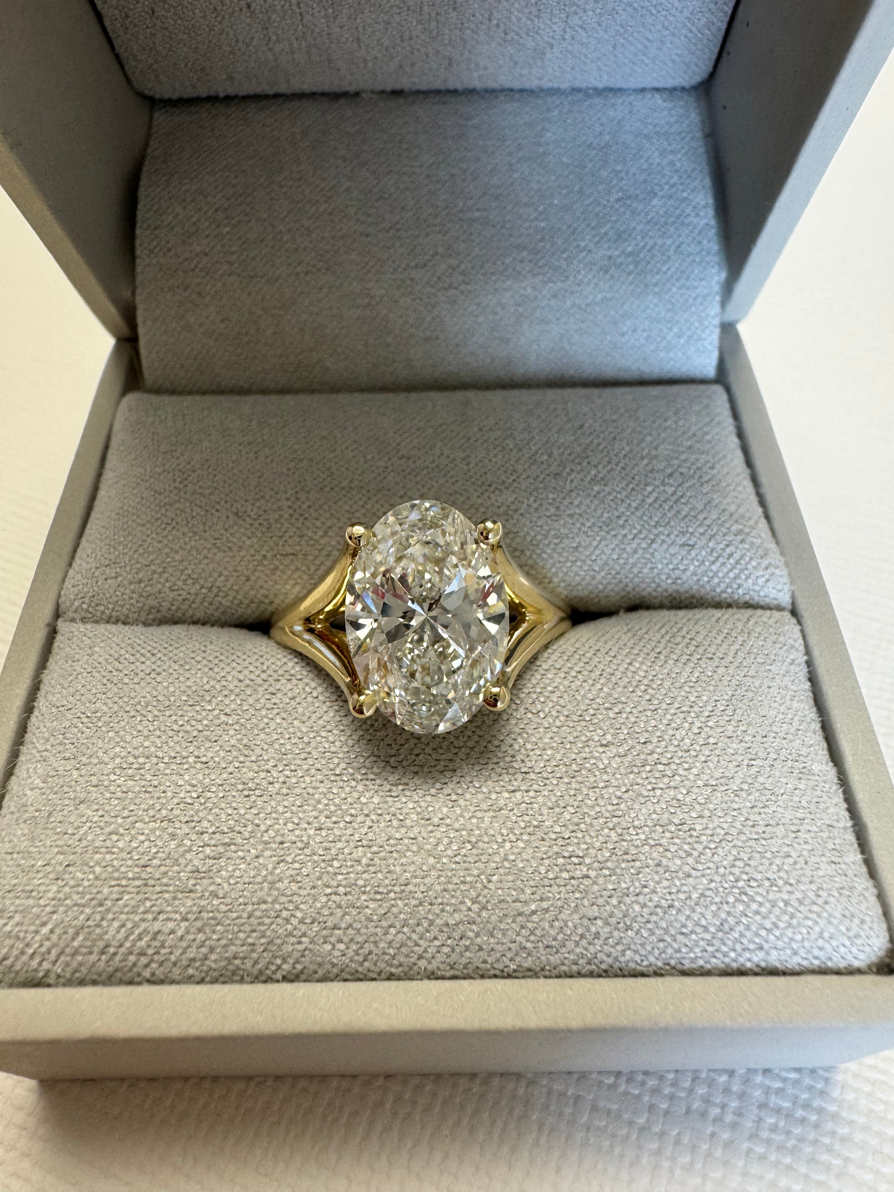 Pymt 1 of 4: Custom 14k yellow gold lab grown diamond engagement ring. Center= 3.56 ct lab grown oval (E, VS1). Accents= 1mm round lab grown diamonds (.05 cts, F+, VS)