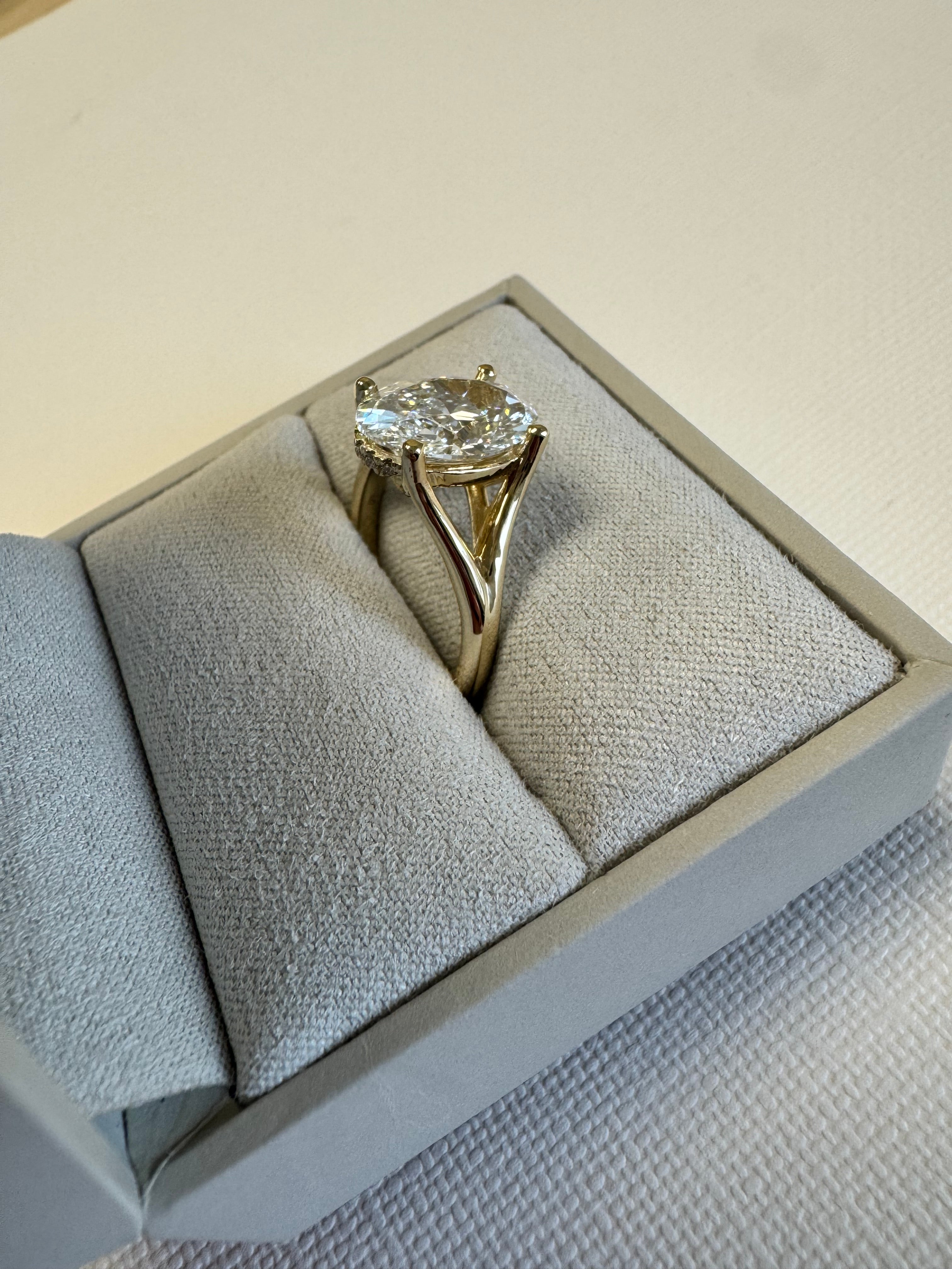 Pymt 1 of 4: Custom 14k yellow gold lab grown diamond engagement ring. Center= 3.56 ct lab grown oval (E, VS1). Accents= 1mm round lab grown diamonds (.05 cts, F+, VS)