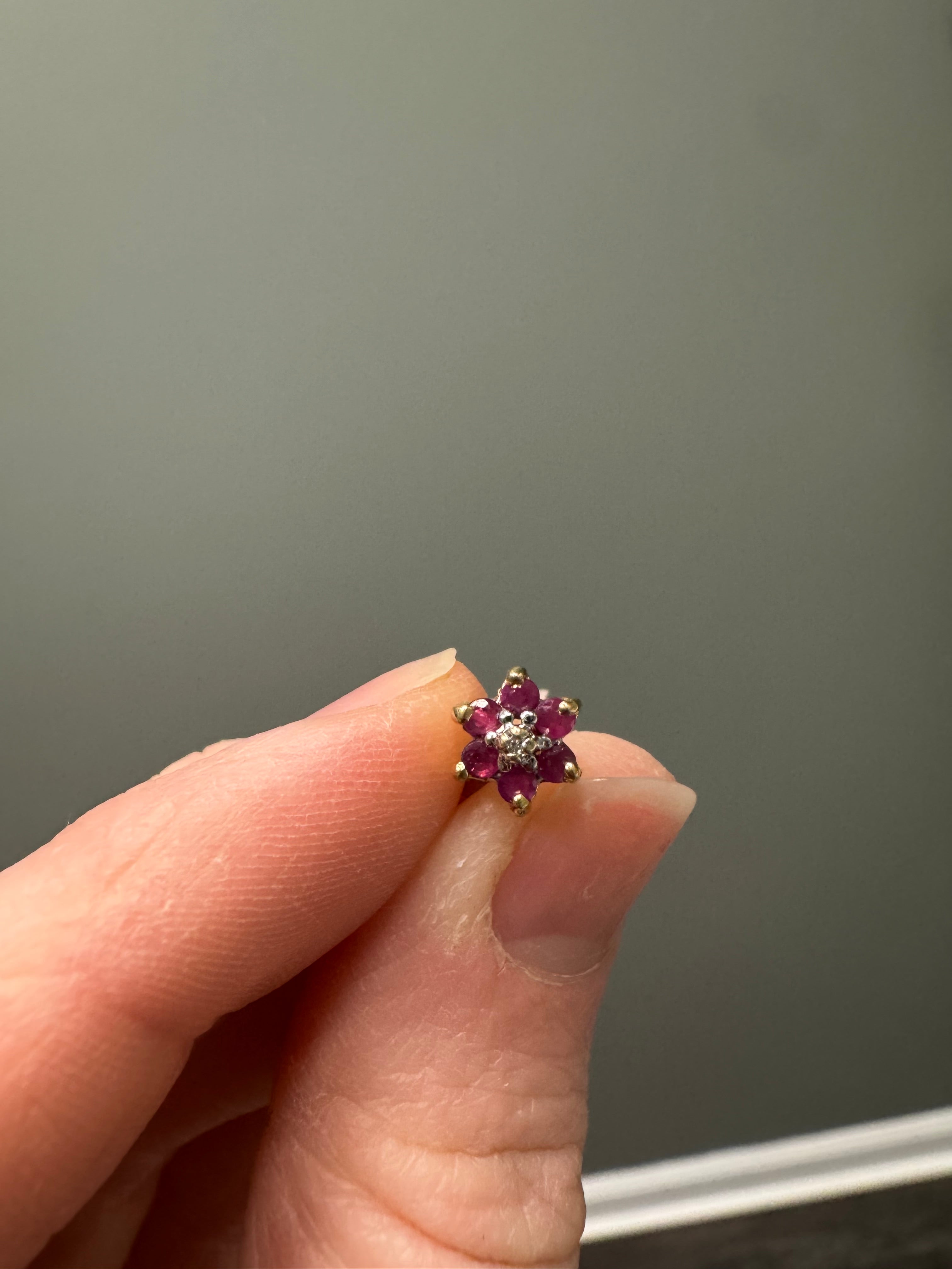 Supply & set round ruby in 10k yellow gold ruby and diamond halo style earring