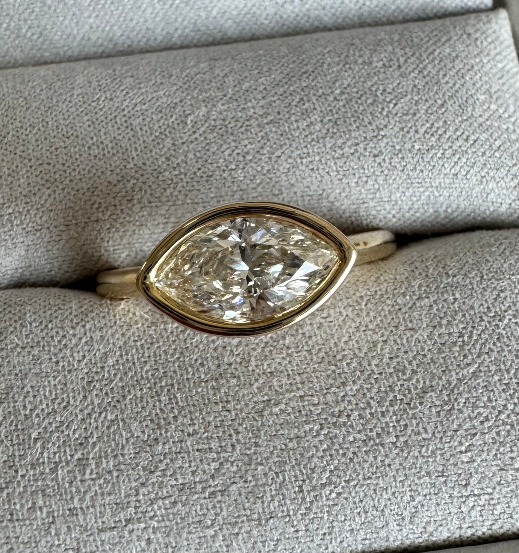 Custom 10k yellow gold bezel set marquise diamond solitaire ring. Size 9. The marquise= 1.55 carats exact.