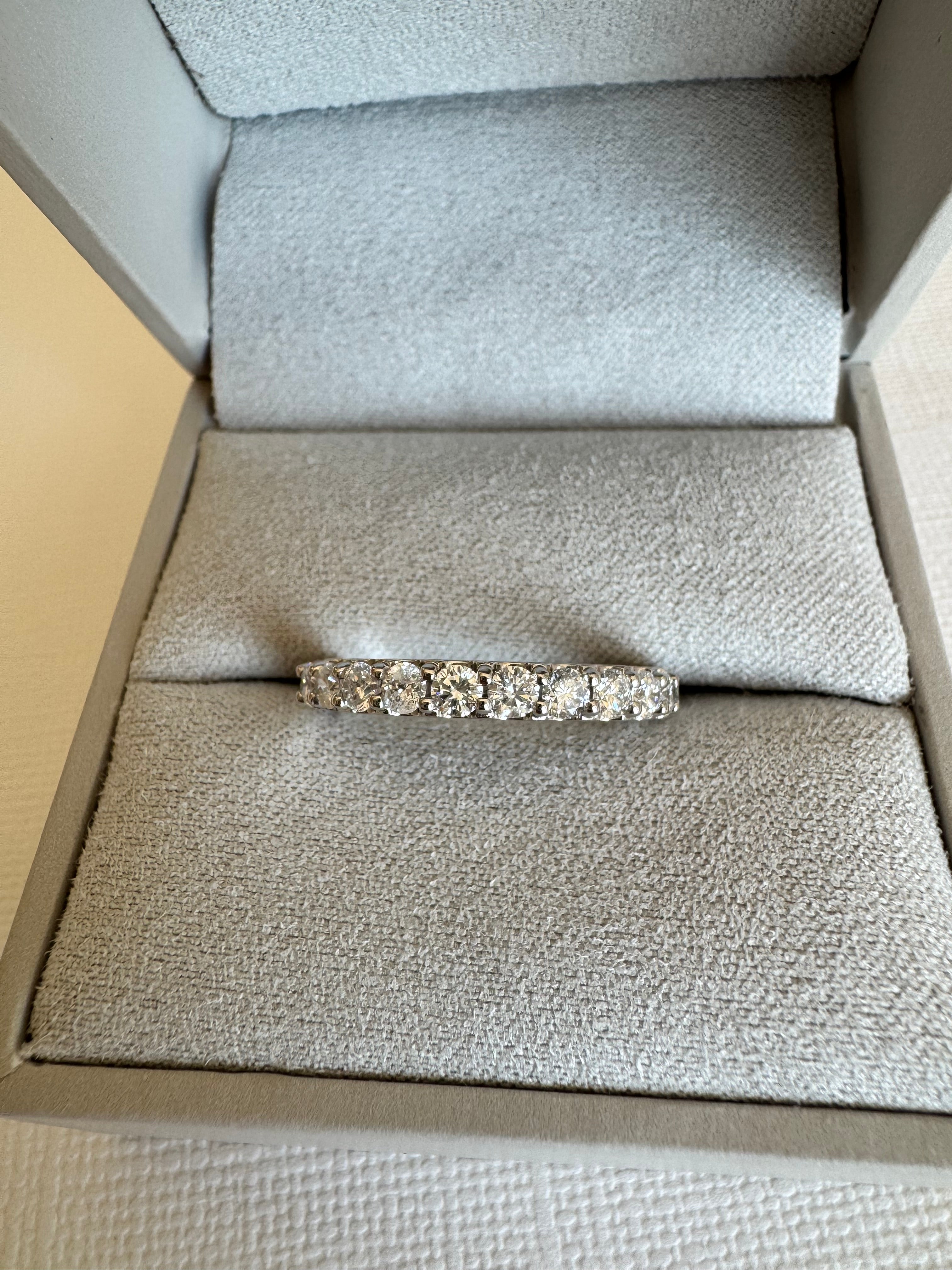 Custom, 14k white gold lab grown diamond band containing 12, round lab grown diamonds totaling approximately .78 carats. Size 7.5.