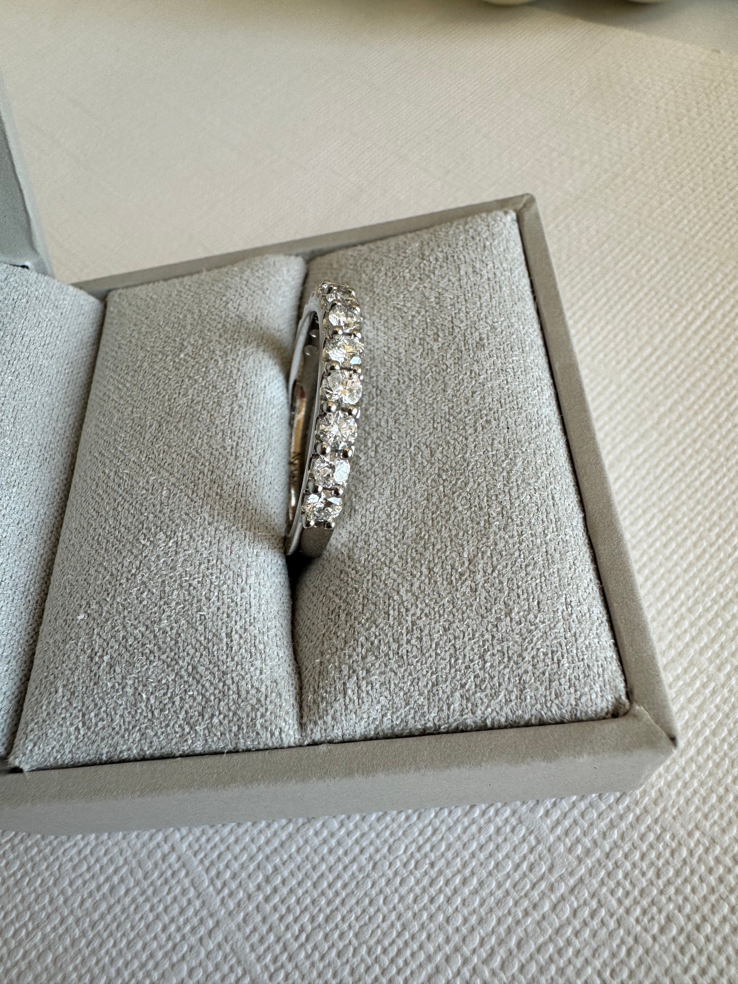 Custom 14k white gold diamond band using customer's 12 approx. 2.5mm round diamonds totaling 0.82 carats. Size 7.5.