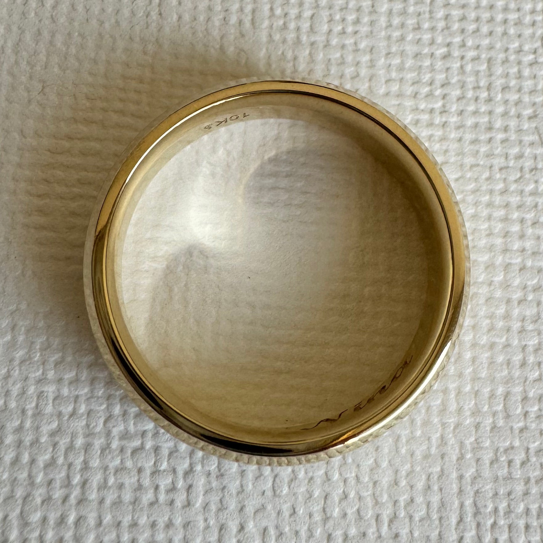 10K Yellow Gold, 6 mm Beveled-Edge, Comfort-Fit, Half Round Band. Size 8.5. The inside is engraved with "Nina" in a Script MT Bold font.