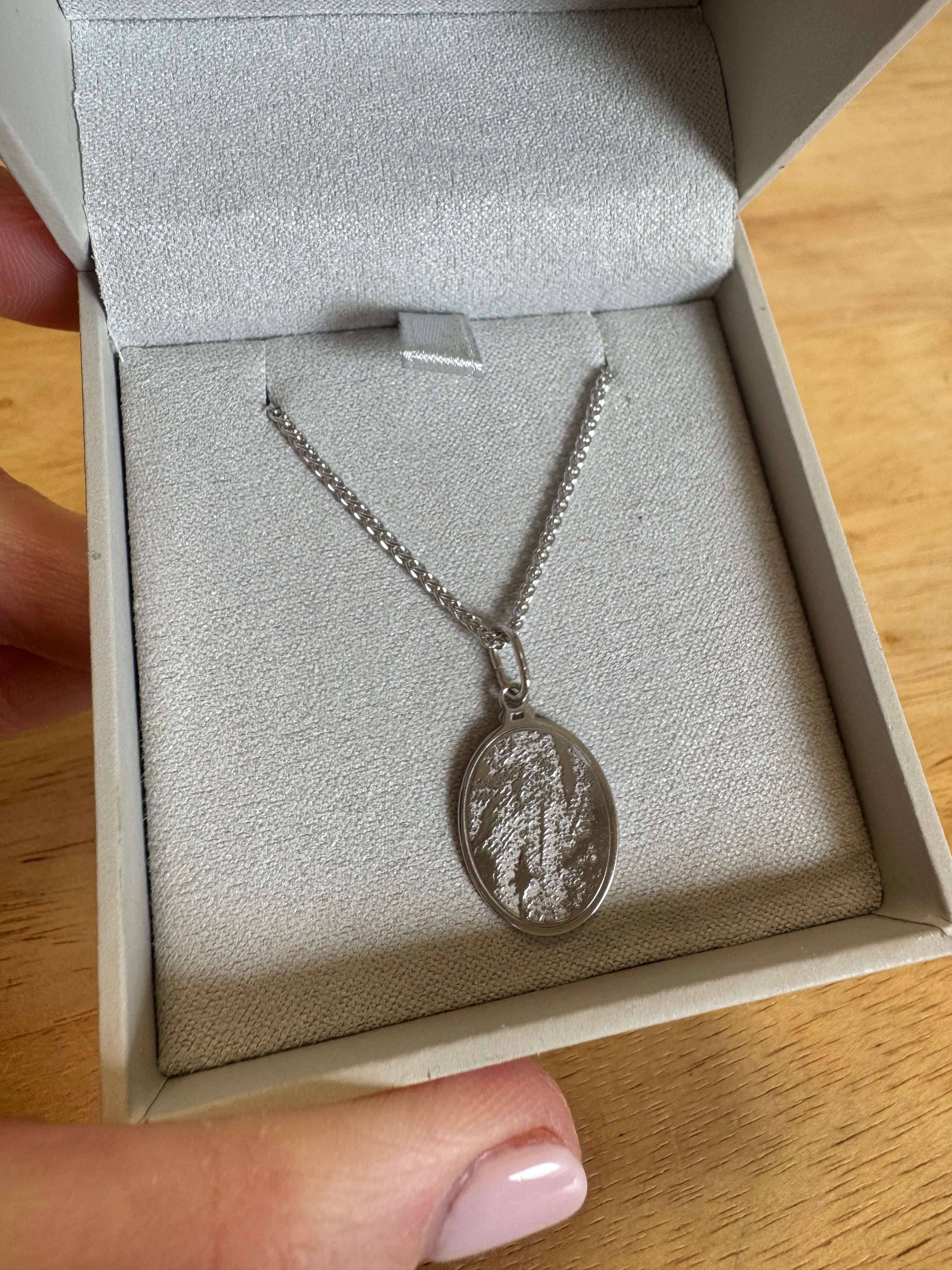 Sterling silver rhodium plated finger print pendant with engraving on back. 20"