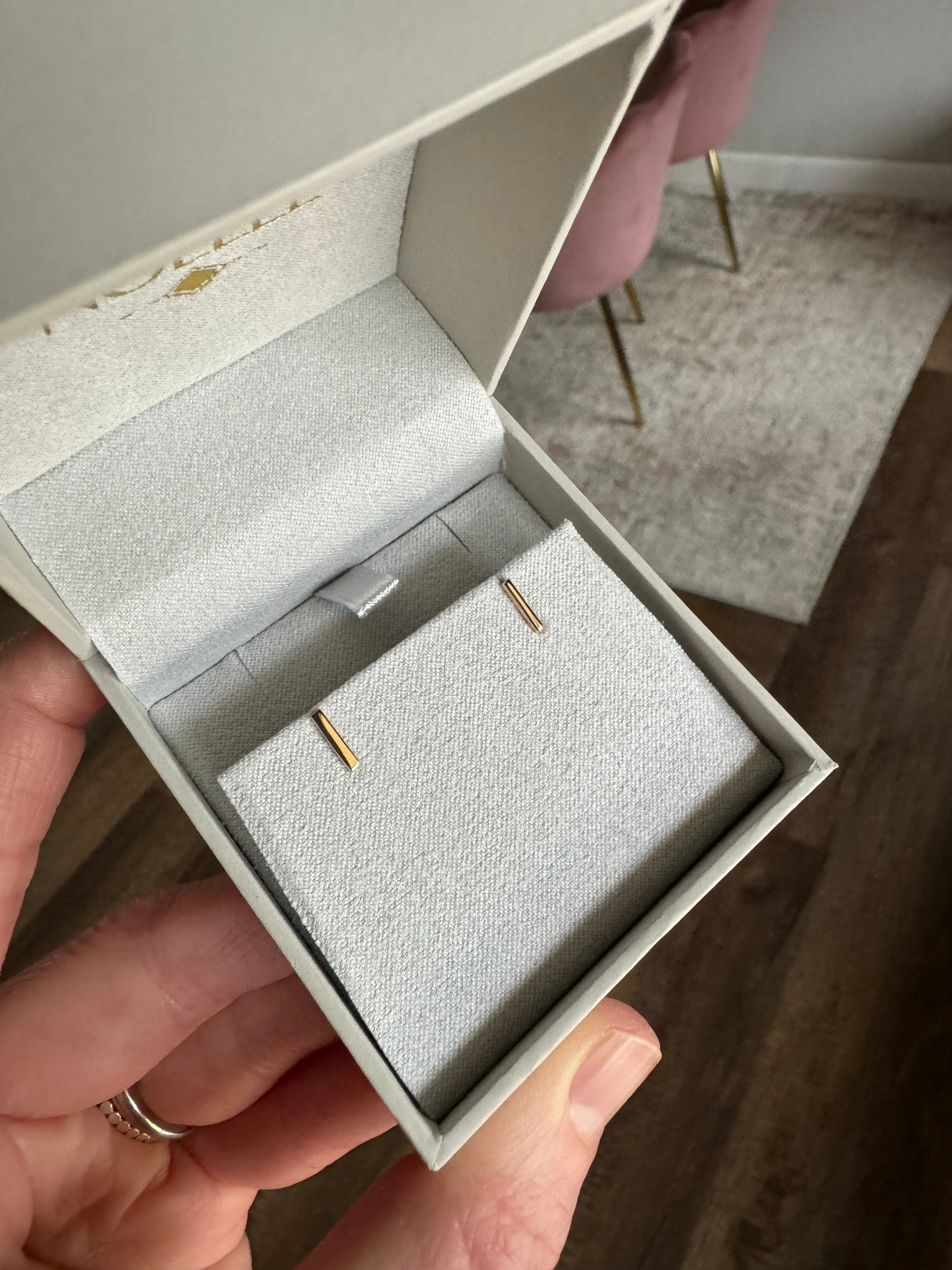 Fabricate 1 pair of 14k yellow gold bar earrrings from customer's 14k yellow gold solitaire ring