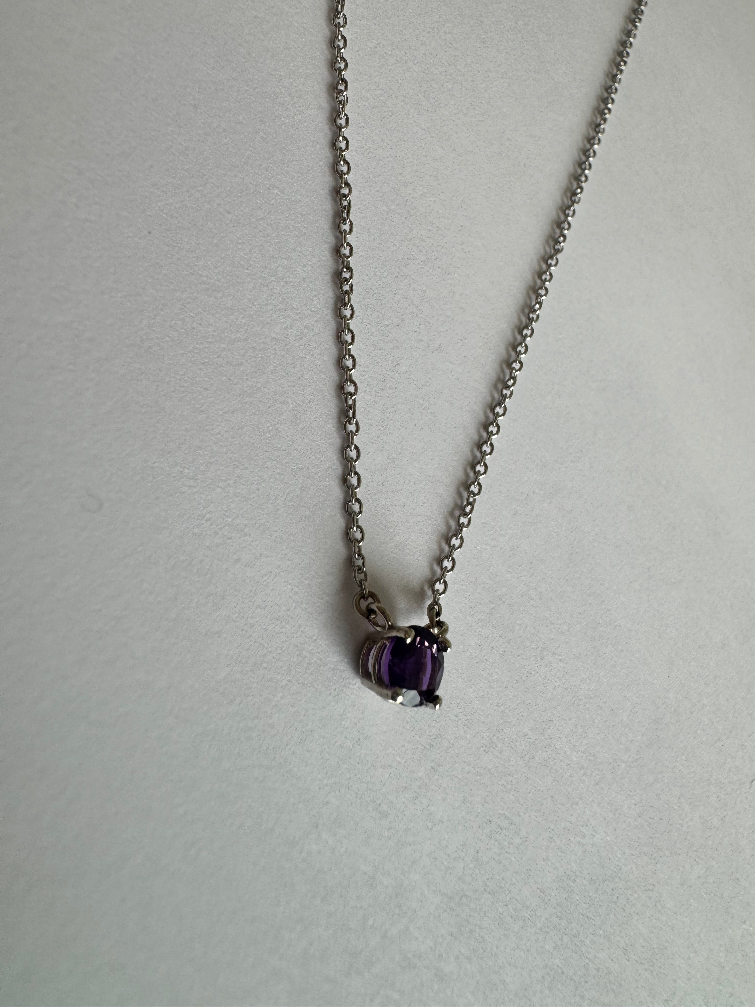 14k white gold solitaire amethyst necklace with 1, 5mm round AAA genuine faceted amethyst stationed in the chain in a 4 prong basket setting. 18" with a jump ring at 16".