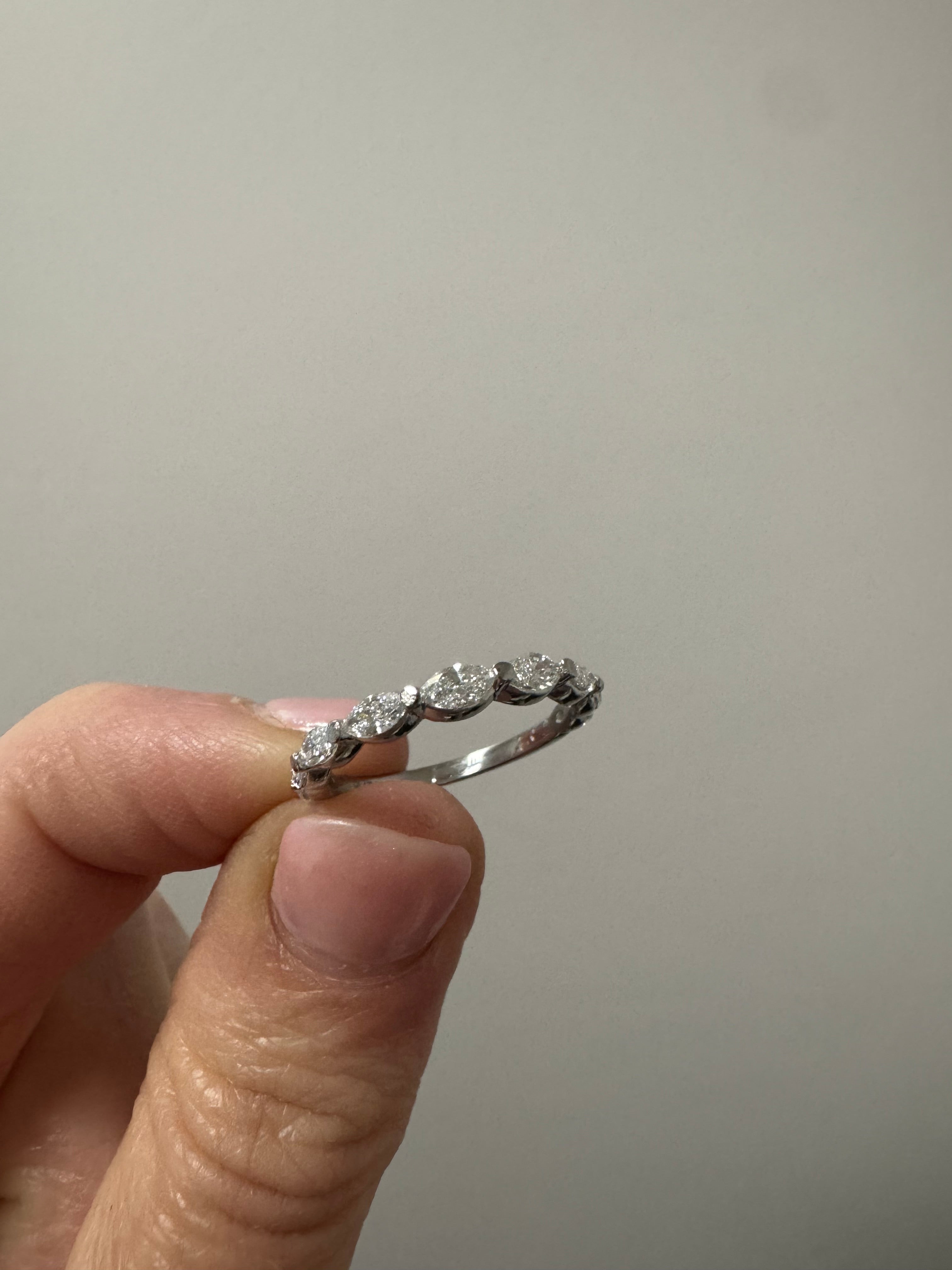 Repair: Platinum lab grown marquise diamond band. Supply & set 1, lab grown marquise measuring 3.75 x 1.75mm (GHI, SI). Check and tighten all stones if needed.