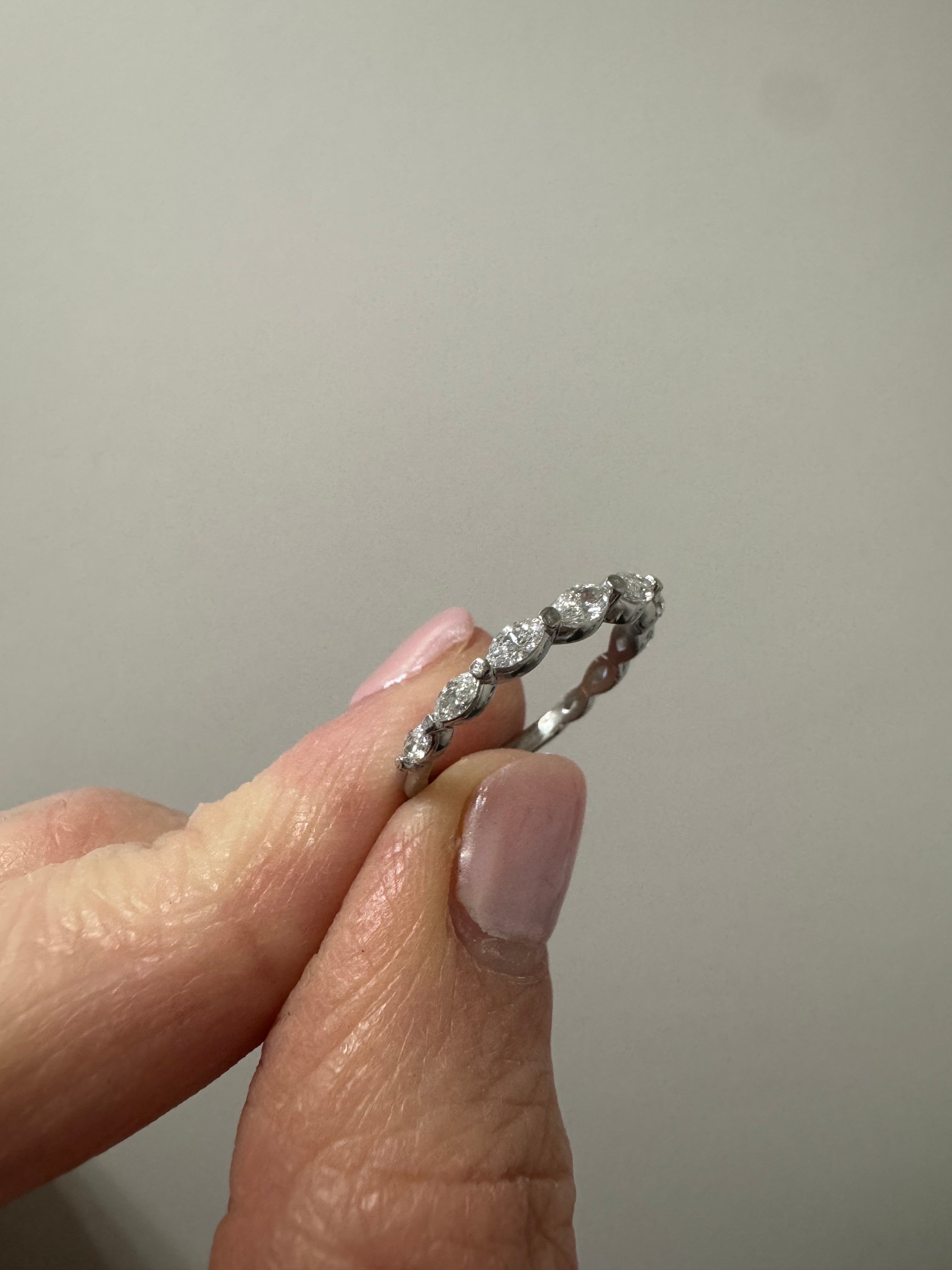 Repair: Platinum lab grown marquise diamond band. Supply & set 1, lab grown marquise measuring 3.75 x 1.75mm (GHI, SI). Check and tighten all stones if needed.