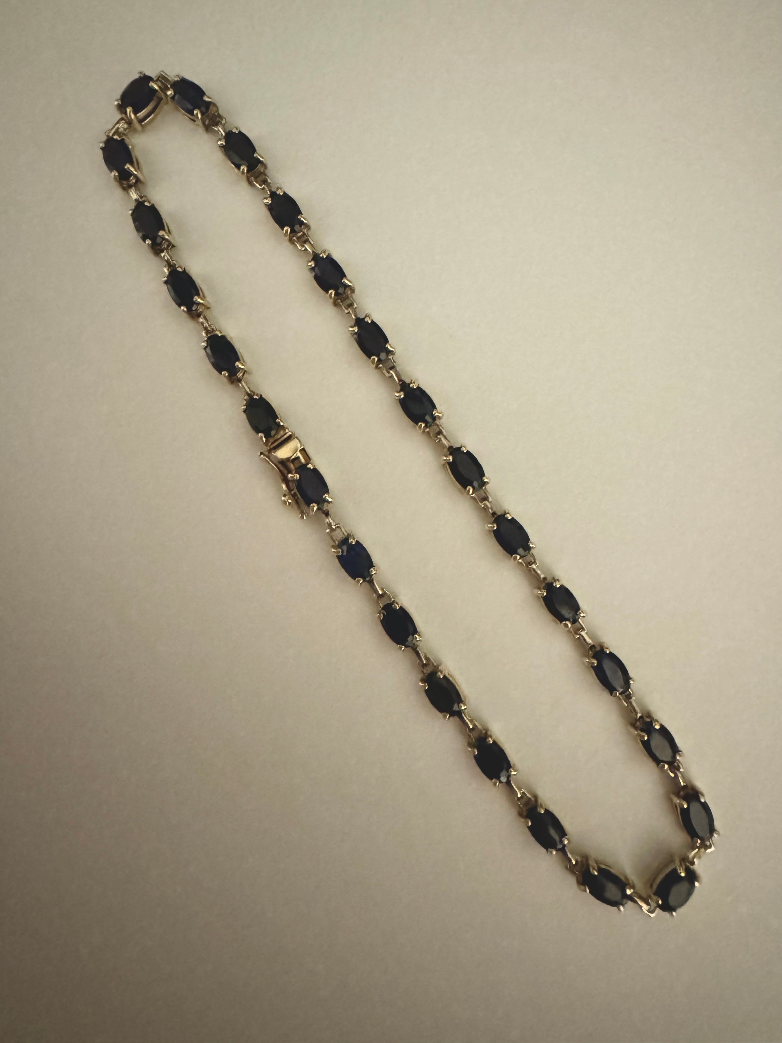 Repair: Supply & set 5 x 3mm genuine oval sapphire in 10k y/g sapphire tennis bracelet