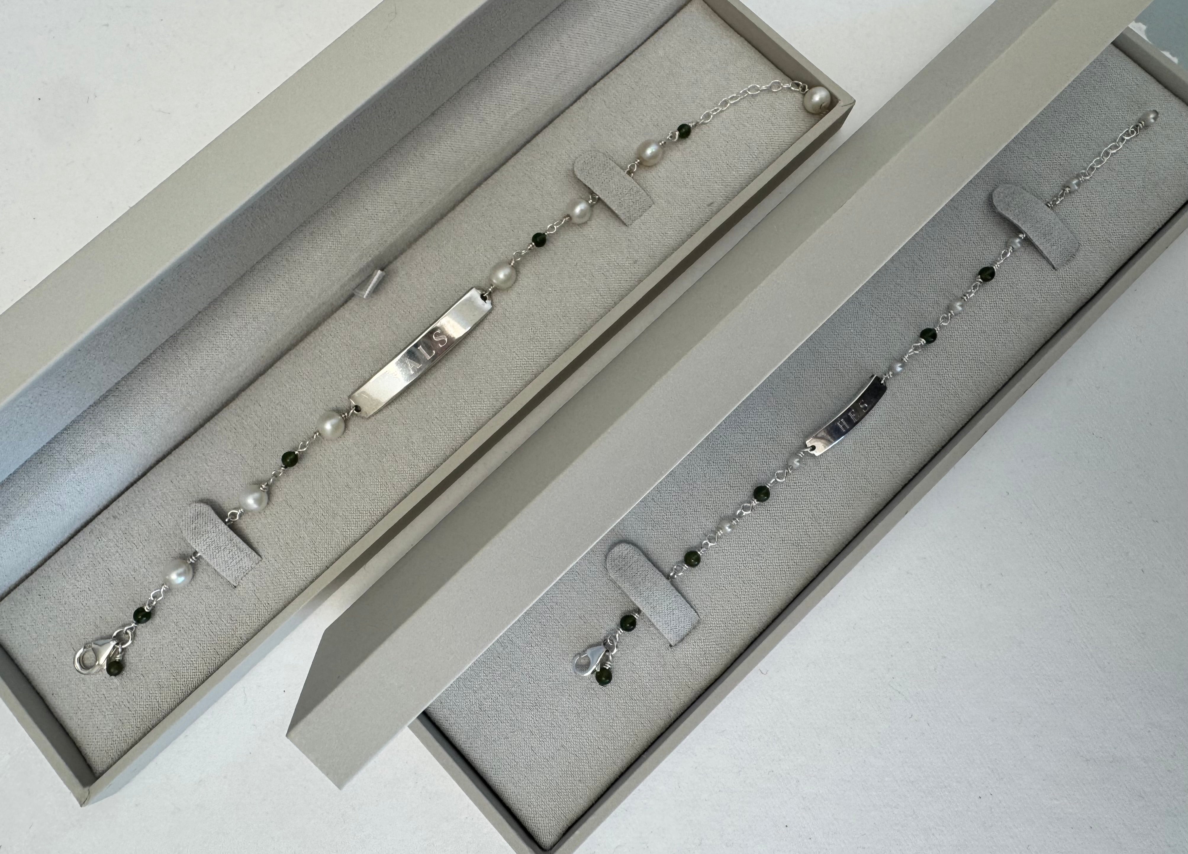 Create sterling silver wire station bracelet with customer's engraved bar center & customer's pearls. Supply Jade to alternate with pearls. 7" + 1" extender.