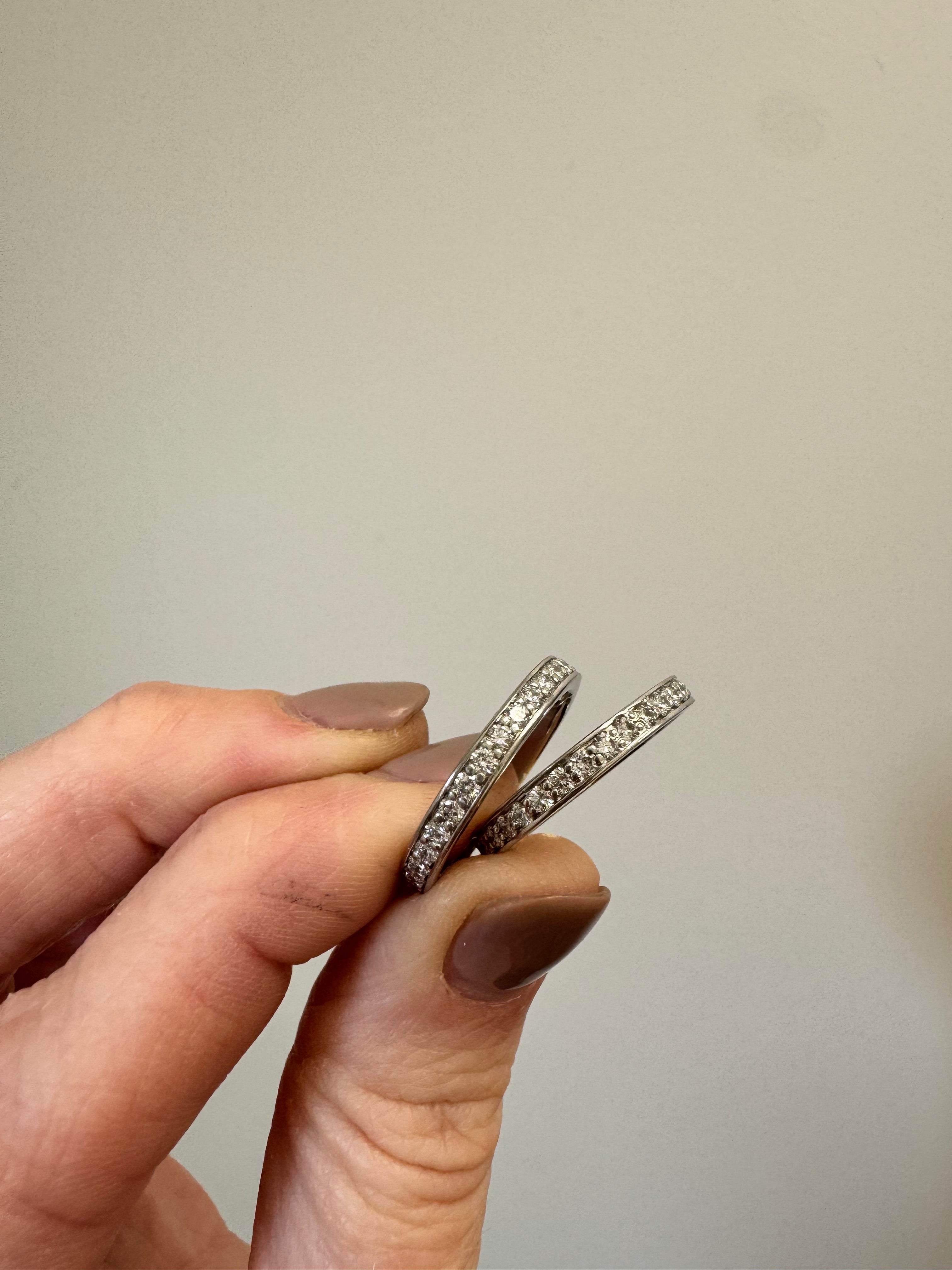 2- ladies platinum bead set diamond eternity bands. Add platinum sizing beads to take up approximately 1/4 size.