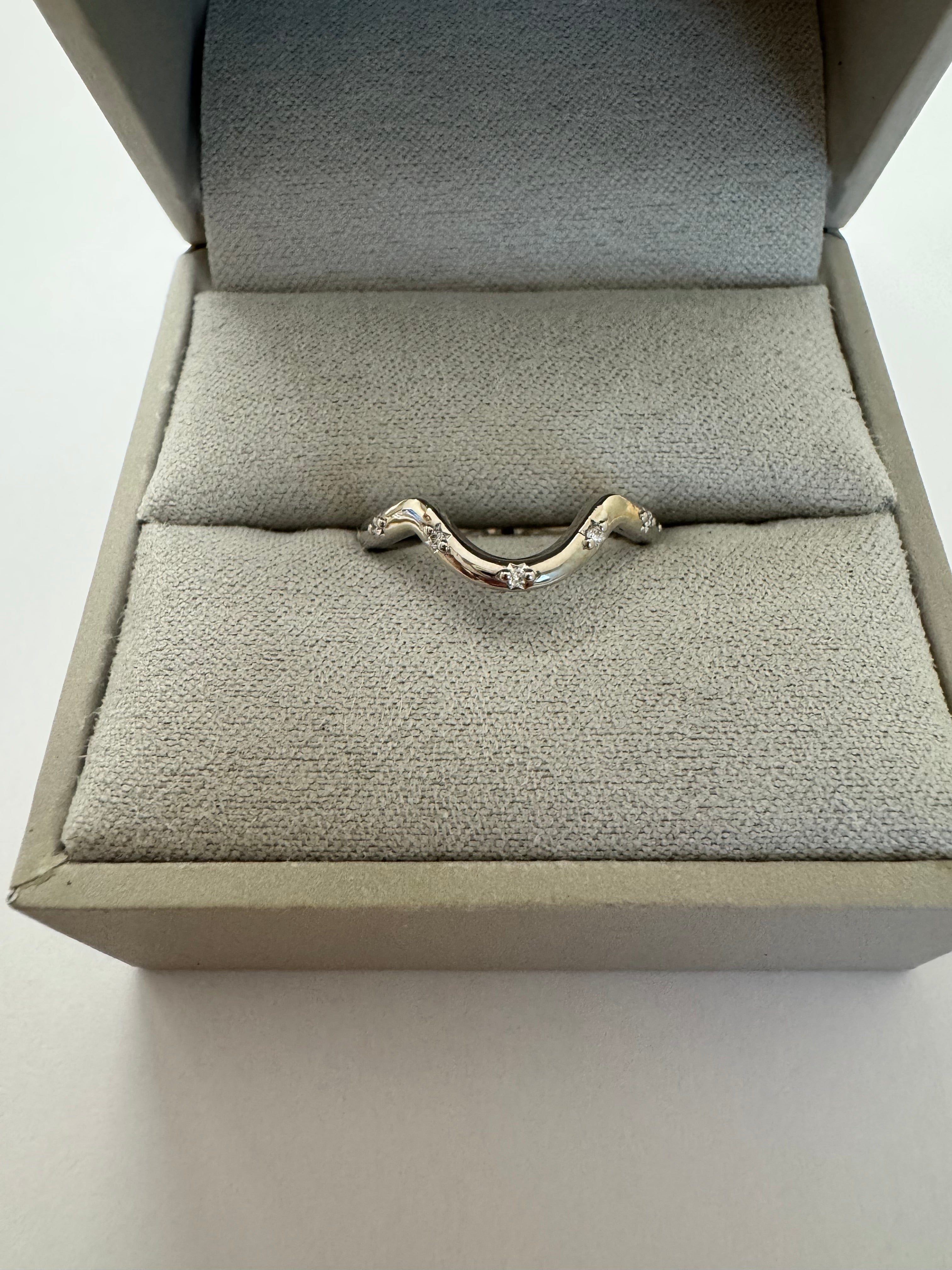 Custom 14k white gold lab grown diamond curved wedding band. Size 5.