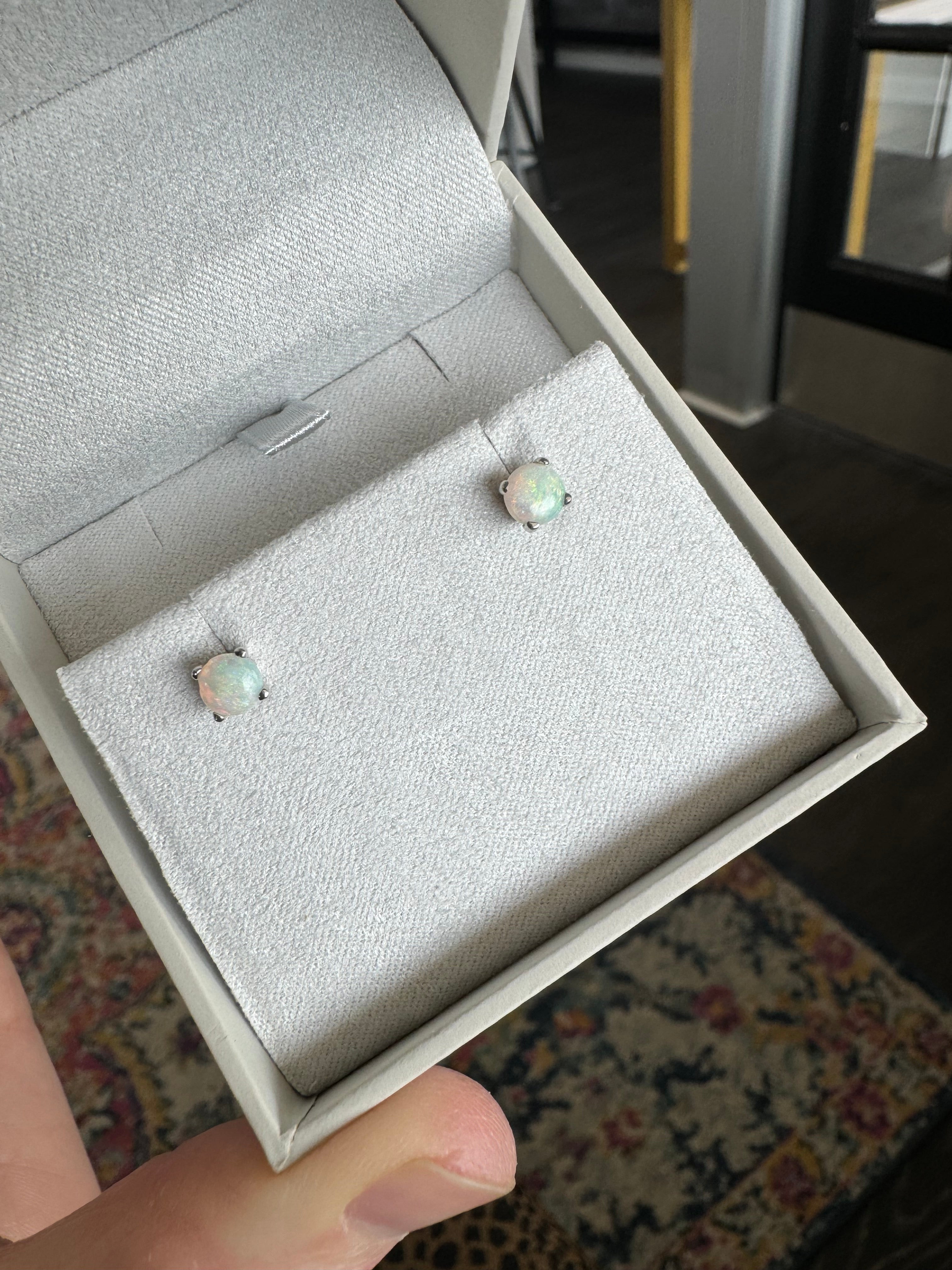 Reset white 5 mm opals in 4 prongs 14k white gold stud settings (reuse backs)