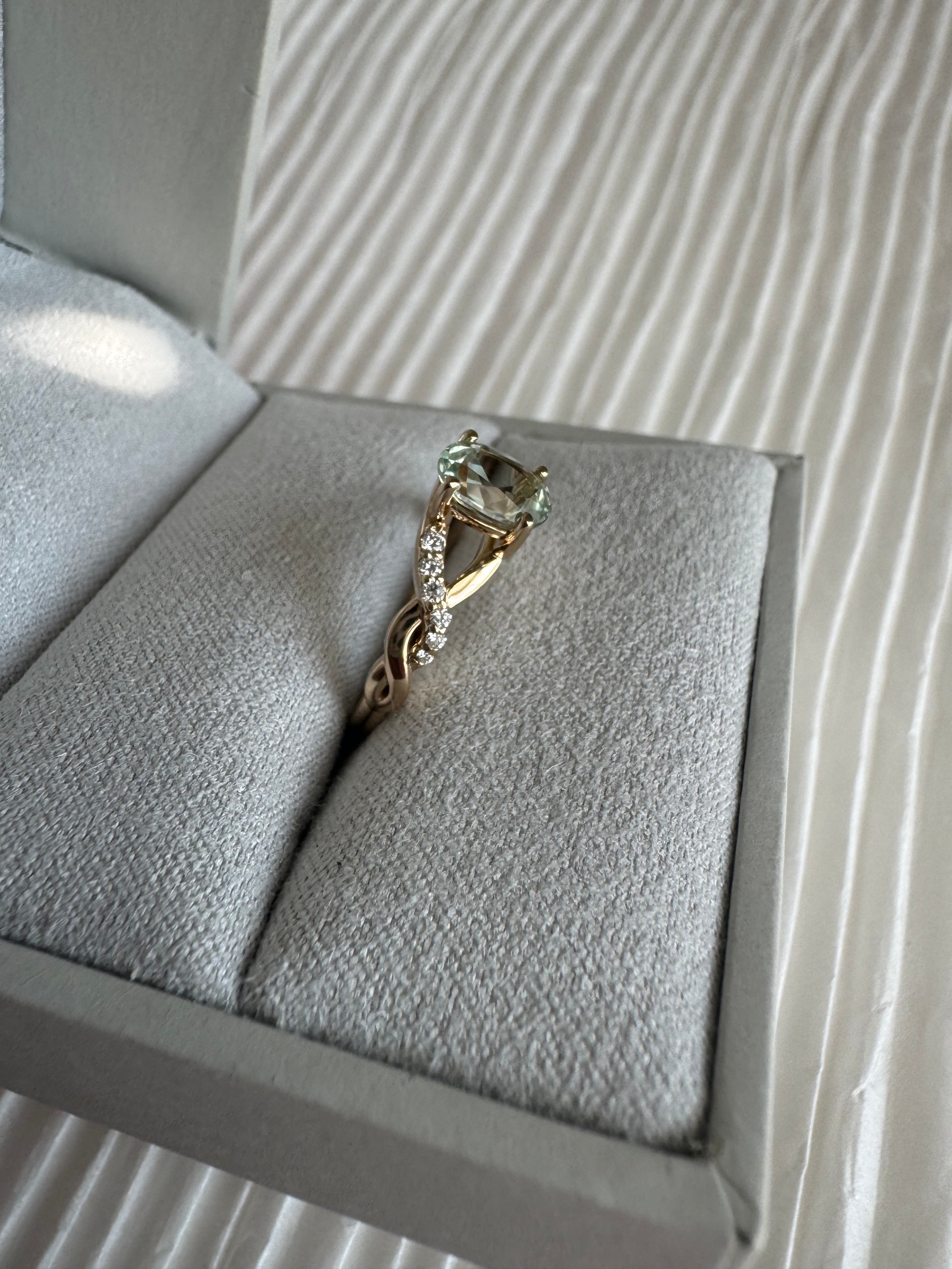 Custom 14k yellow gold lab grown oval green sapphire (1.12 cts.) and lab grown diamond (approx. 0.095cts.) engagement ring. Size 5.5