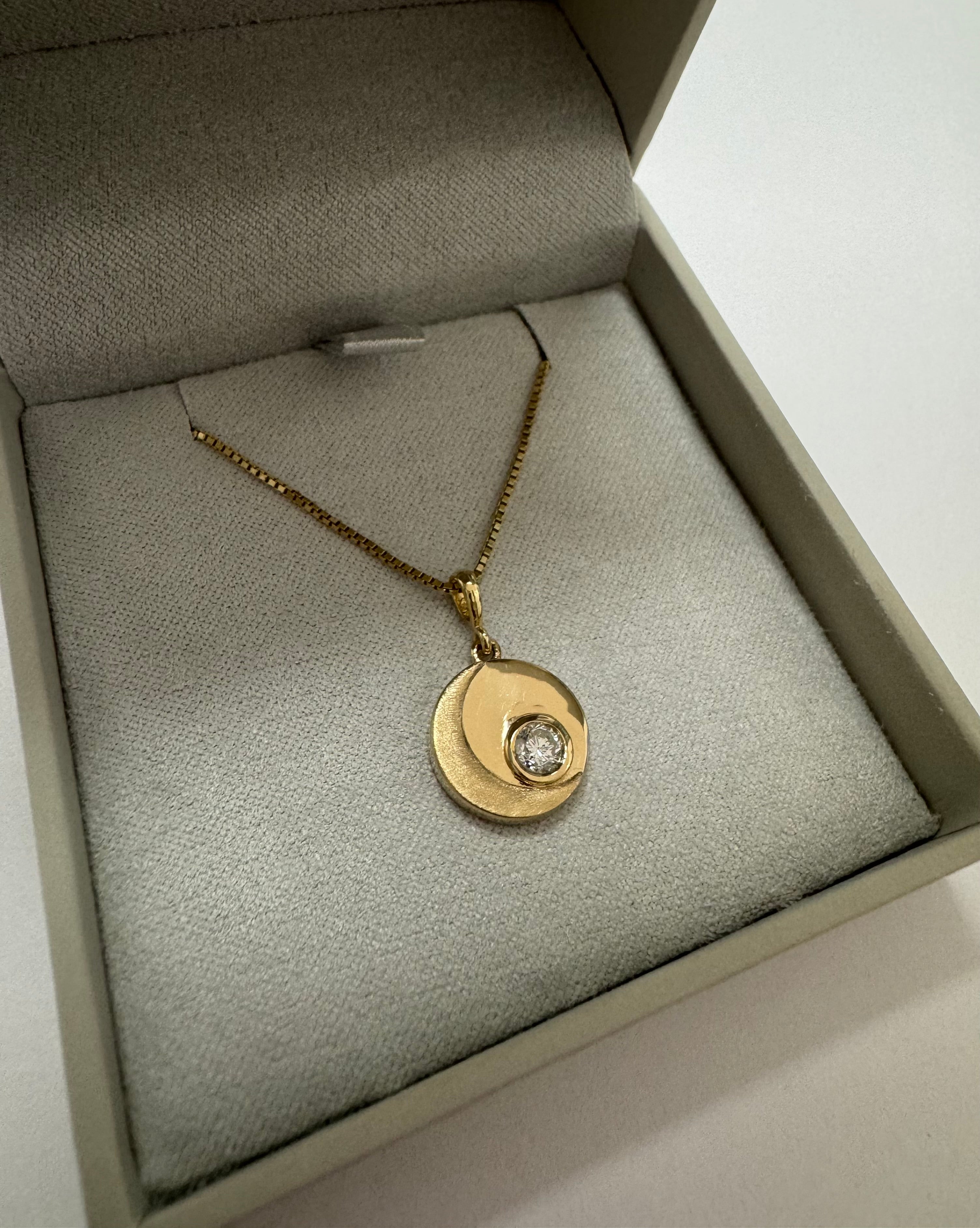 Custom 14k yellow gold crescent moon pendant set with customer's .20 carat round diamond.