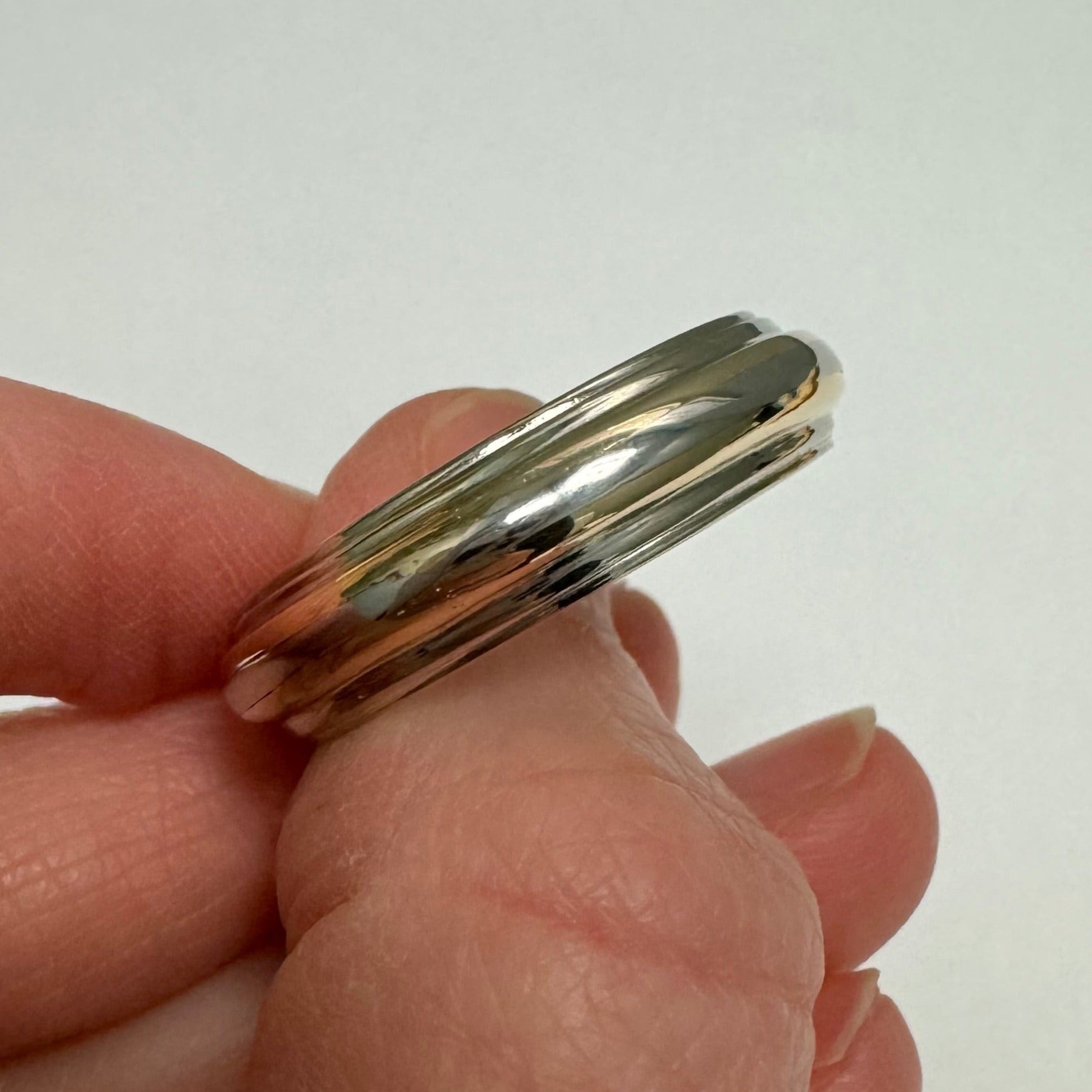 Repair: Gents 14k yellow & white gold and platinum band. Size from 10.75 to 14. Polish.