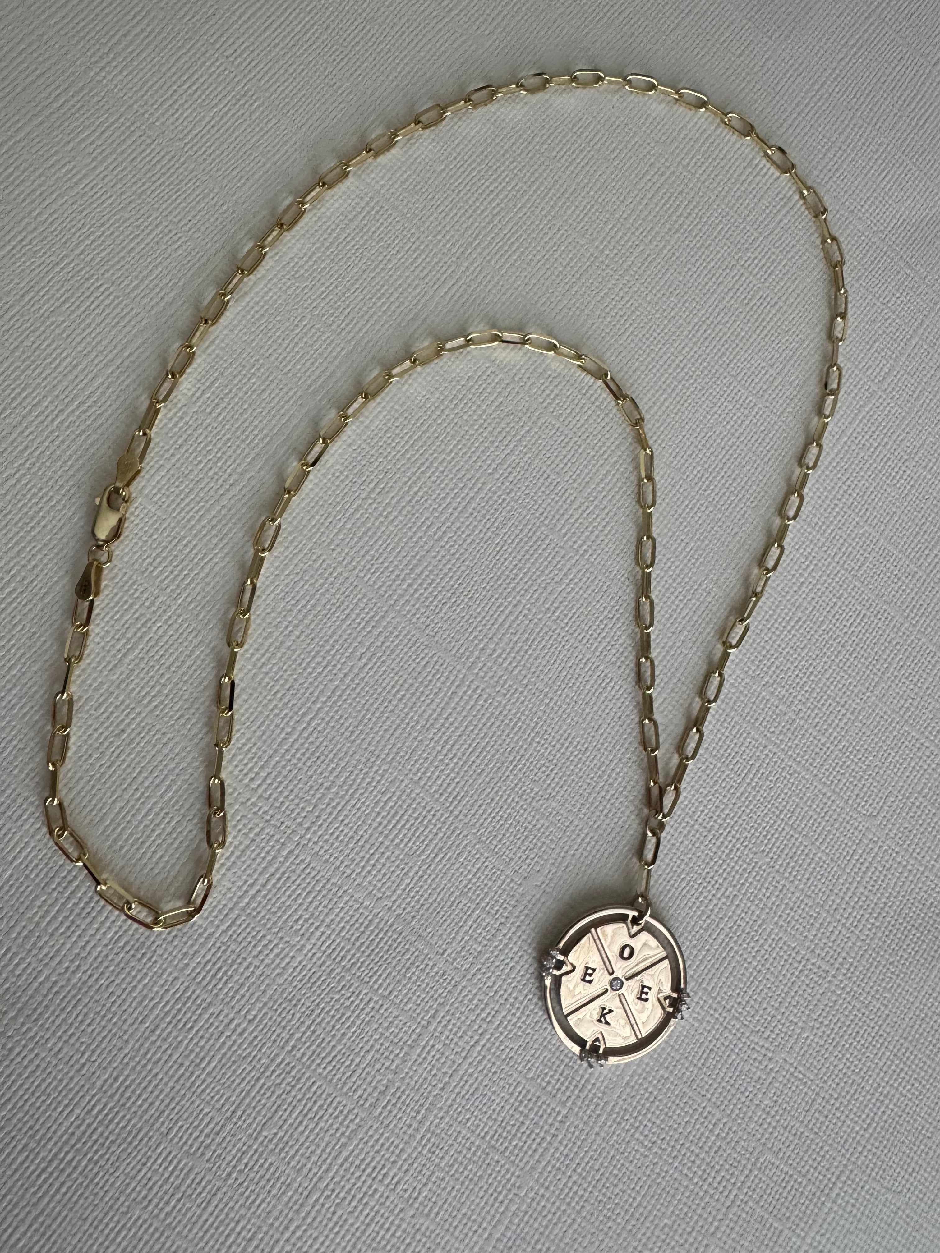 14k yellow gold compass necklace on a 22" paper clip chain with initials O, E, E, K and 10 round natural diamonds