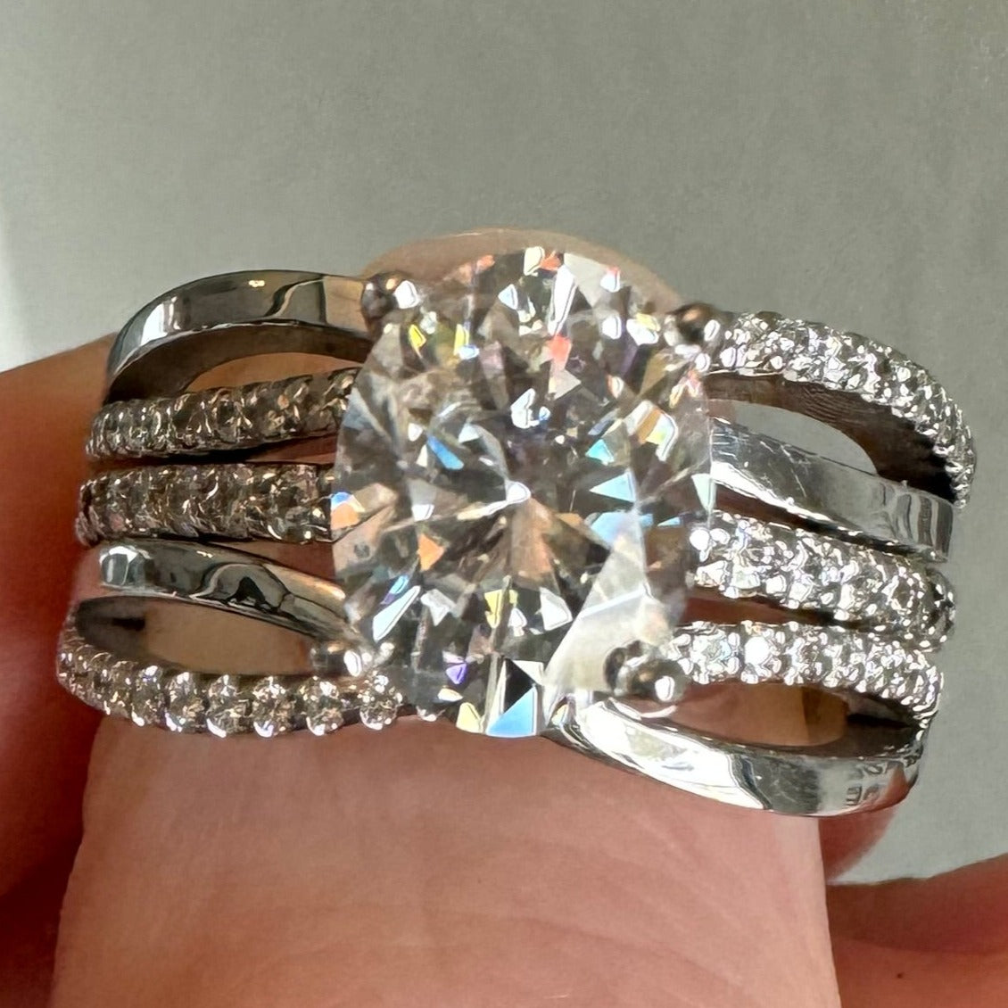 Repair: 14k w/g moissanite wedding set. Size up 1/4 size, weld together & rhodium/polish.