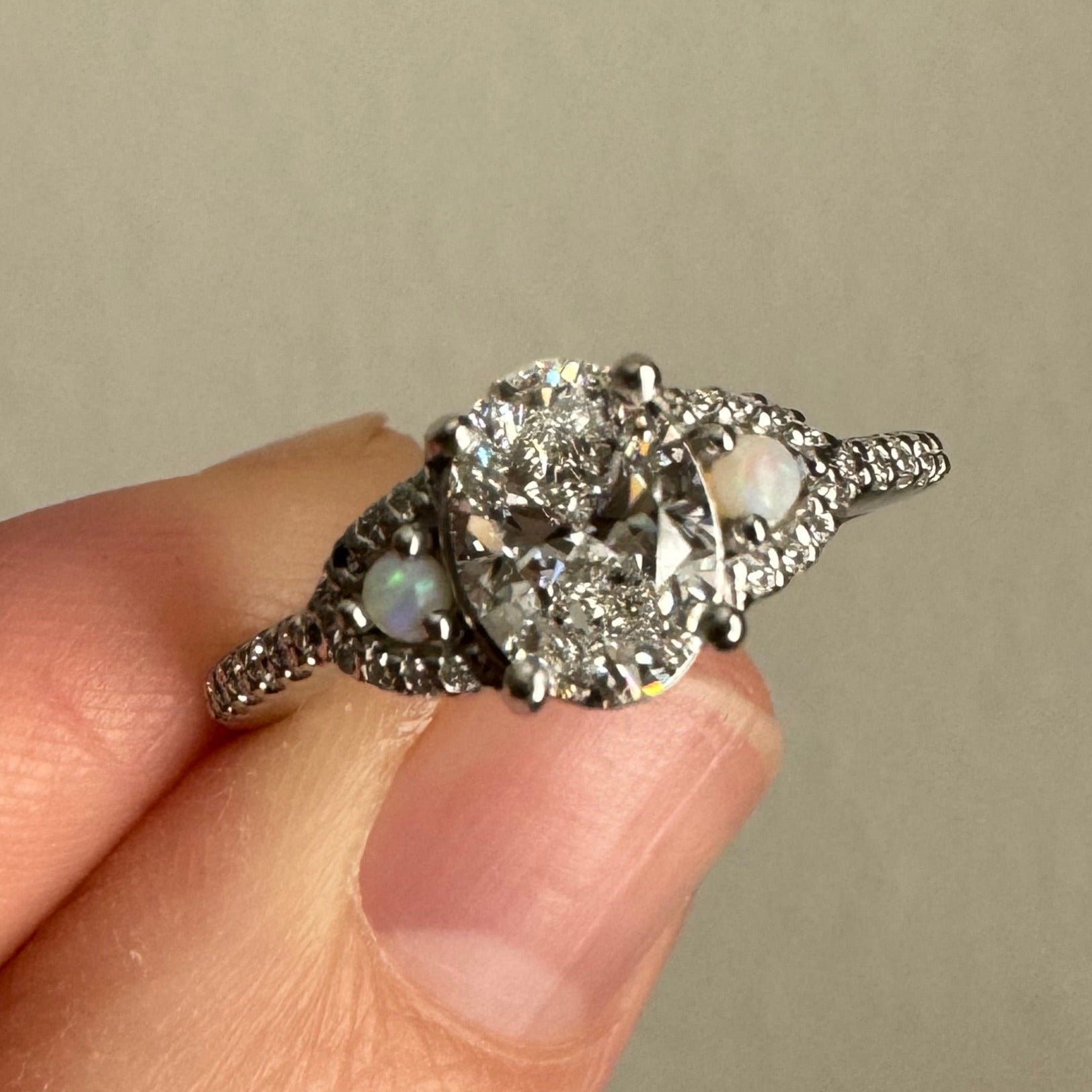 Supply & set 1.00 ct oval lab grown diamond in place of broken opal