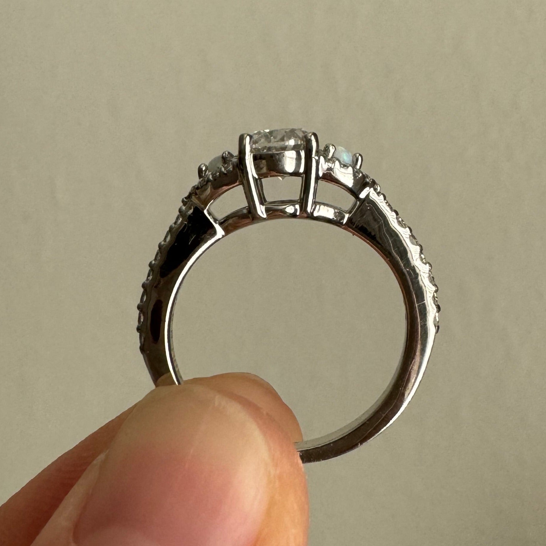 Supply & set 1.00 ct oval lab grown diamond in place of broken opal