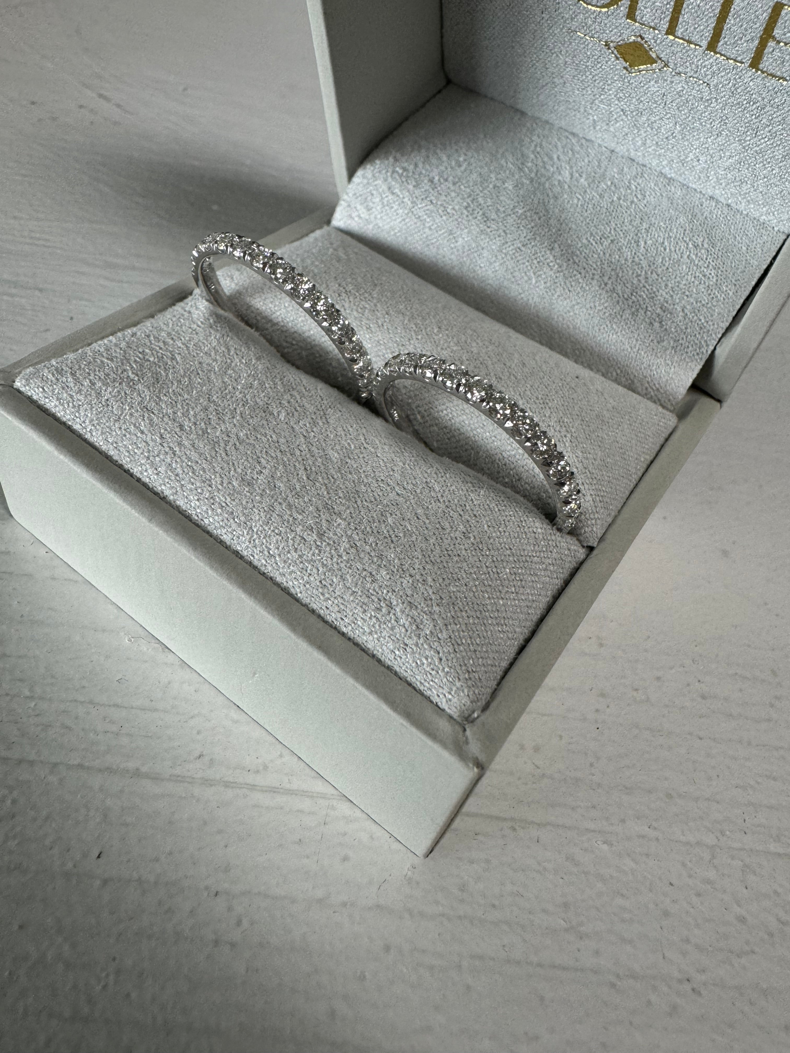2- 14k white gold prong set diamonds bands totaling .45 carats each. Size 8.75.