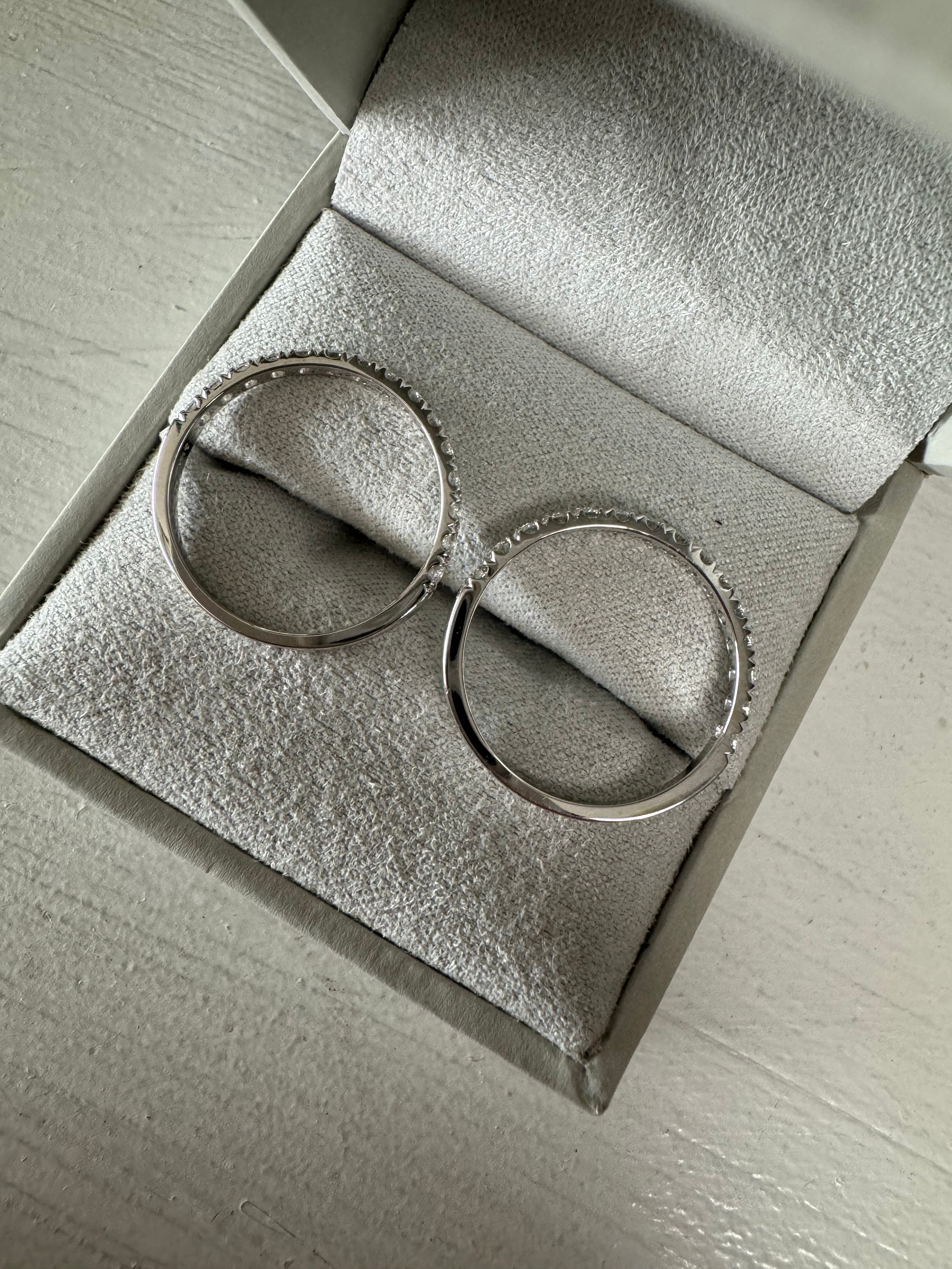 2- 14k white gold prong set diamonds bands totaling .45 carats each. Size 8.75.