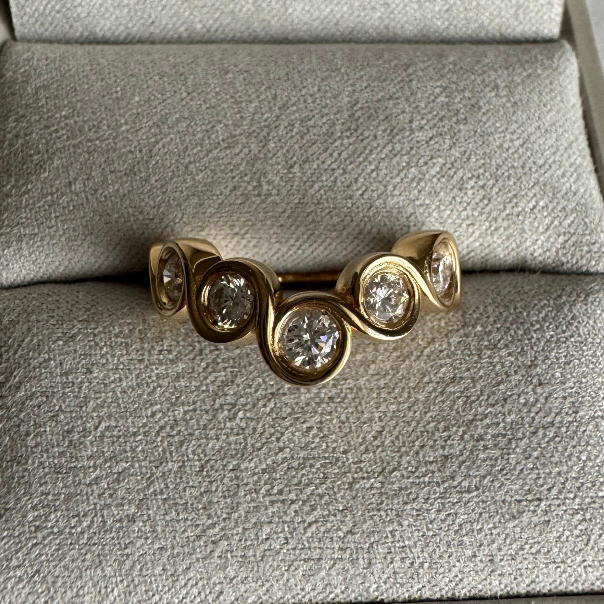 Custom 14k yellow gold curved bezel diamond wedding band - size 6.25