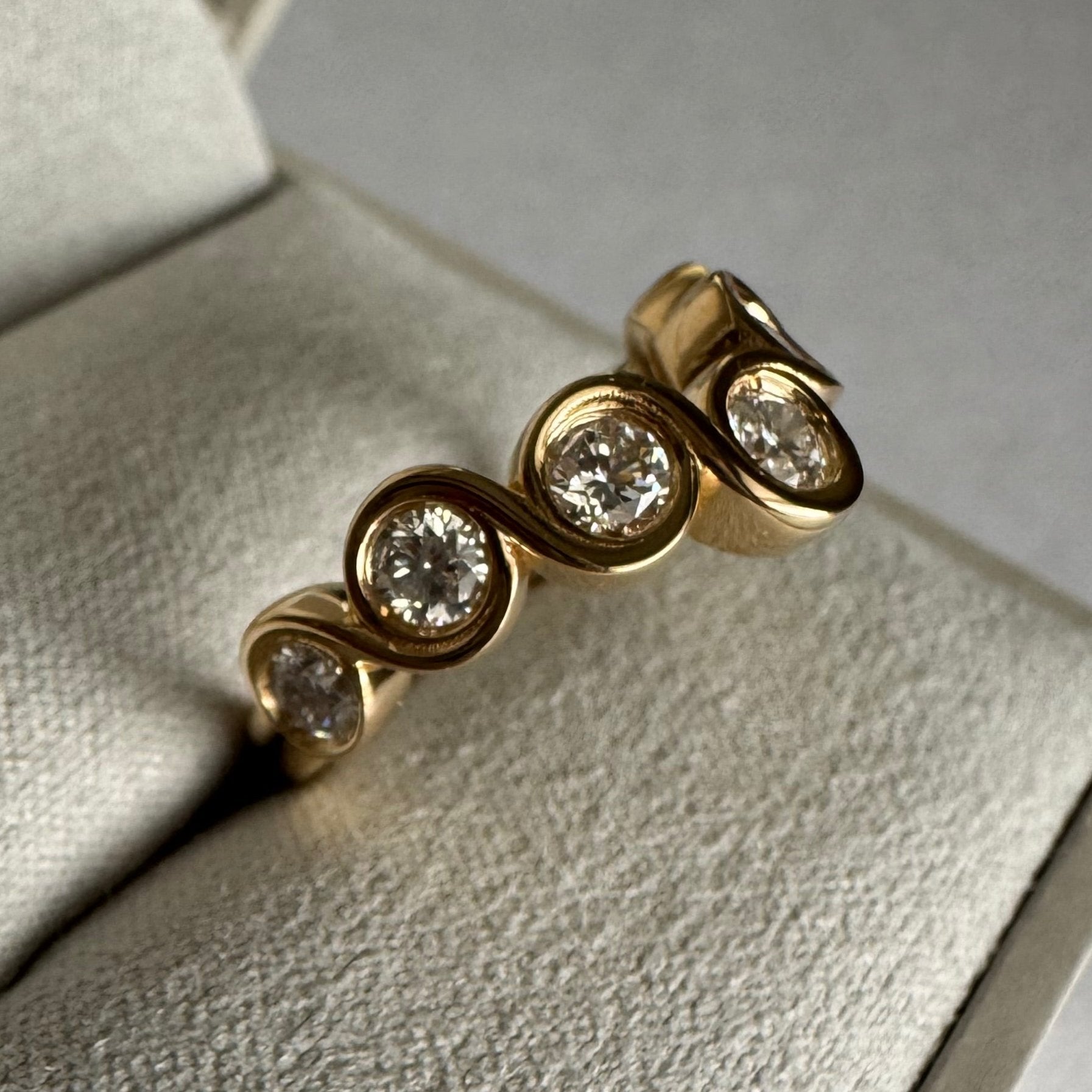 Custom 14k yellow gold curved bezel diamond wedding band - size 6.25