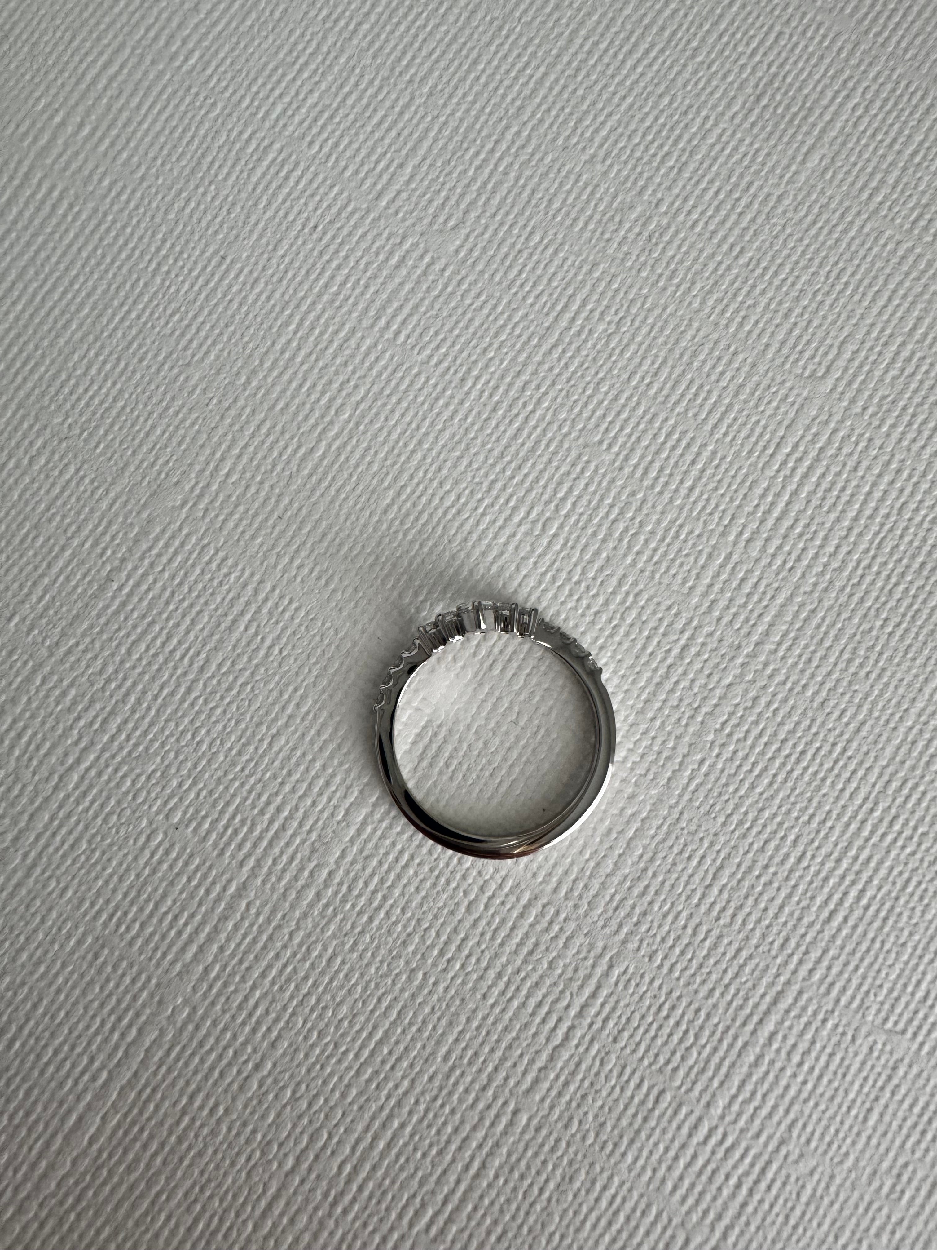 Custom 14k white gold curved lab grown diamond band with a pear shaped center. Size 6.5. Carat weight approx. 0.37 cts.