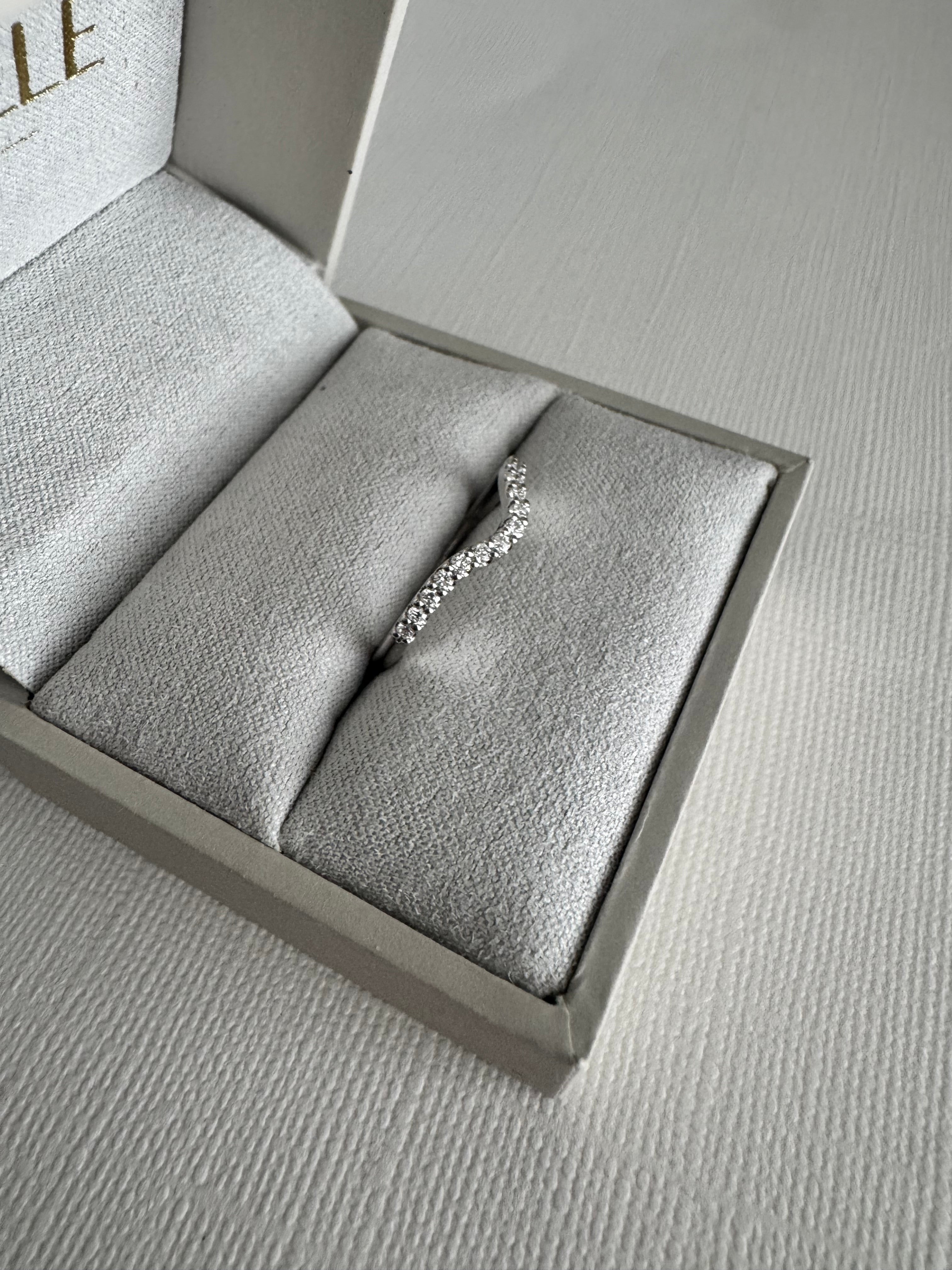 Custom 14k white gold lab grown diamond curved wedding band. Size 6.5. Carat weight approx. 0.23 carats.