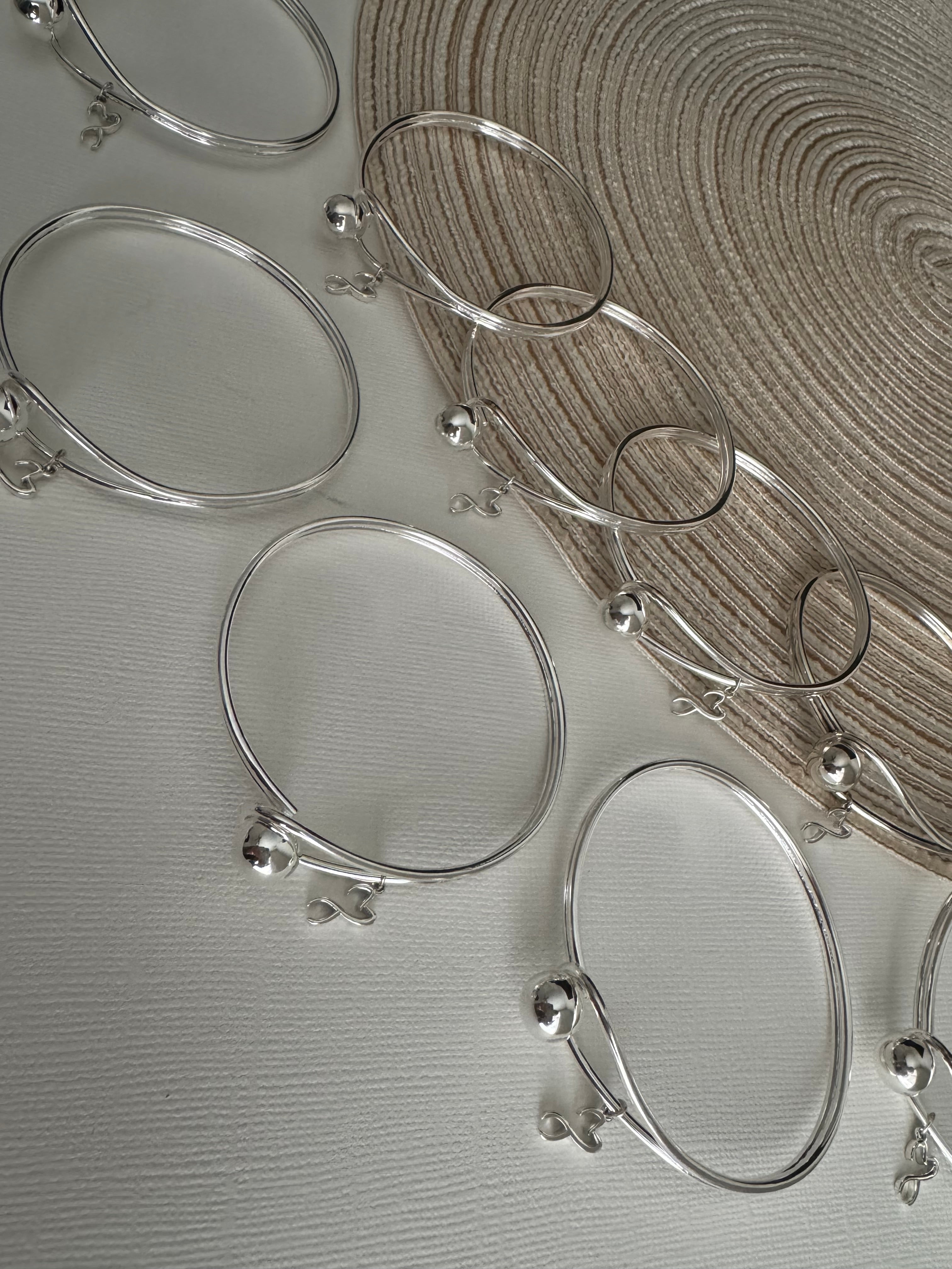 9- Sterling Silver Bangle Bracelets with Ekko Tooth Charm