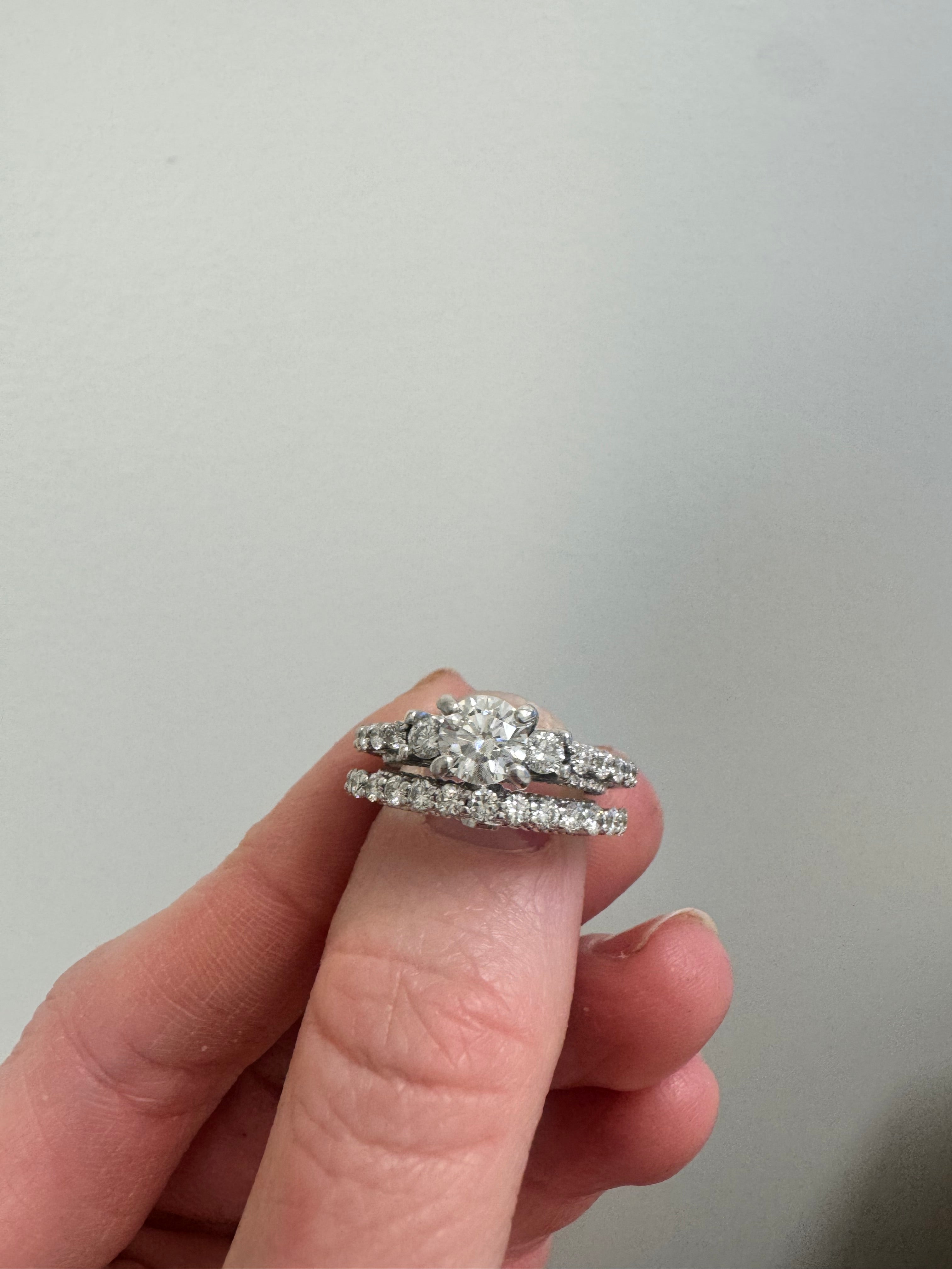White gold vintage style wedding set: Eng ring. supply & set 2 round diamonds in center prongs & retip. Retip 1 prong on last diamond in shank. Rhodium/refinish both rings.