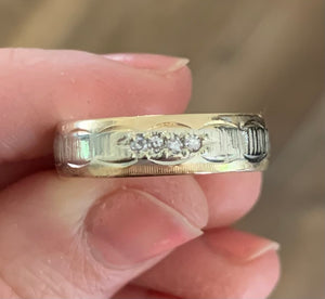 REPAIR: 14k 2-tone etched diamond band. Size down to 10 and retip 4 diamonds. Refinish.