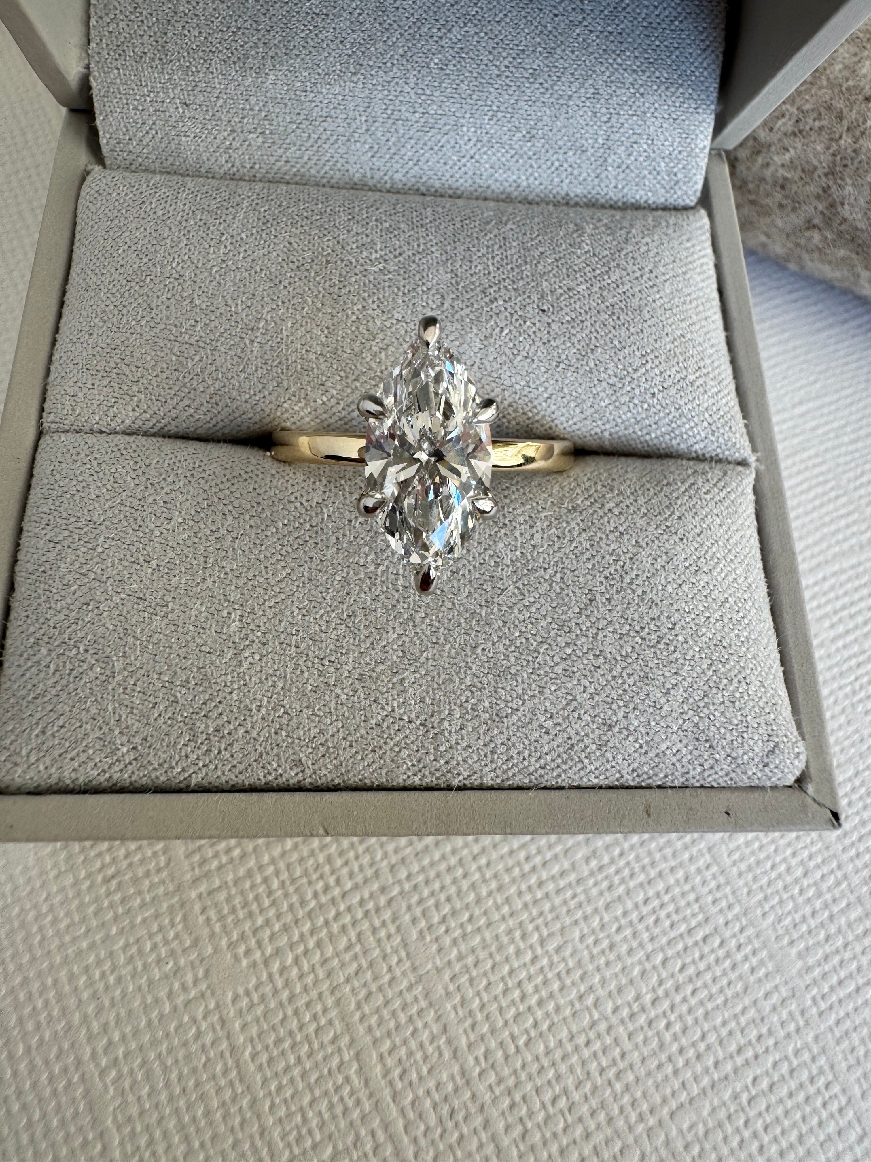 Custom 14k white and yellow gold lab grown marquise solitaire engagement ring. Size 8.5. Center= 2.10 ct lab grown marquise diamond (D color, VS1 clarity) IGI certified.