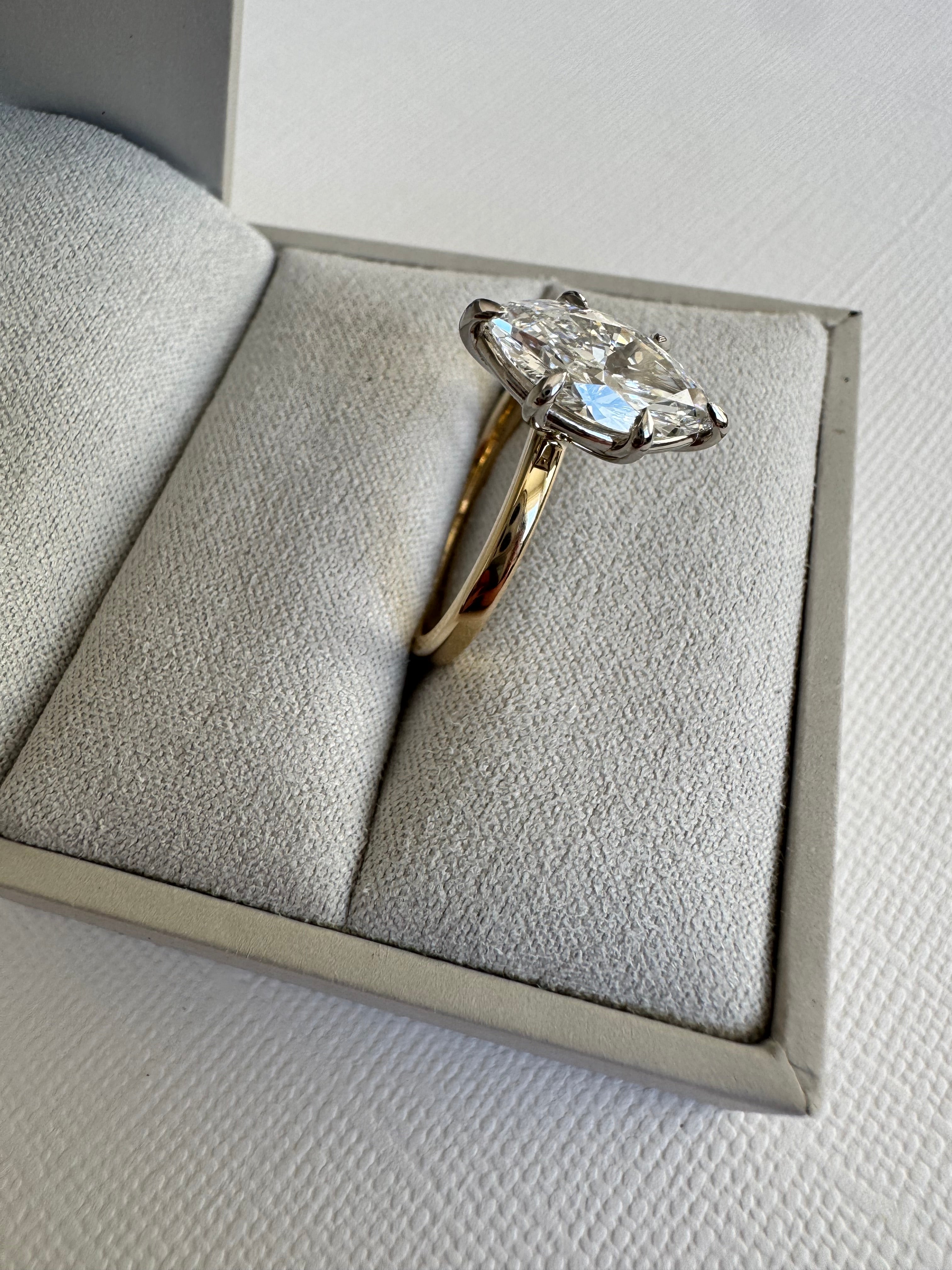 Custom 14k white and yellow gold lab grown marquise solitaire engagement ring. Size 8.5. Center= 2.10 ct lab grown marquise diamond (D color, VS1 clarity) IGI certified.