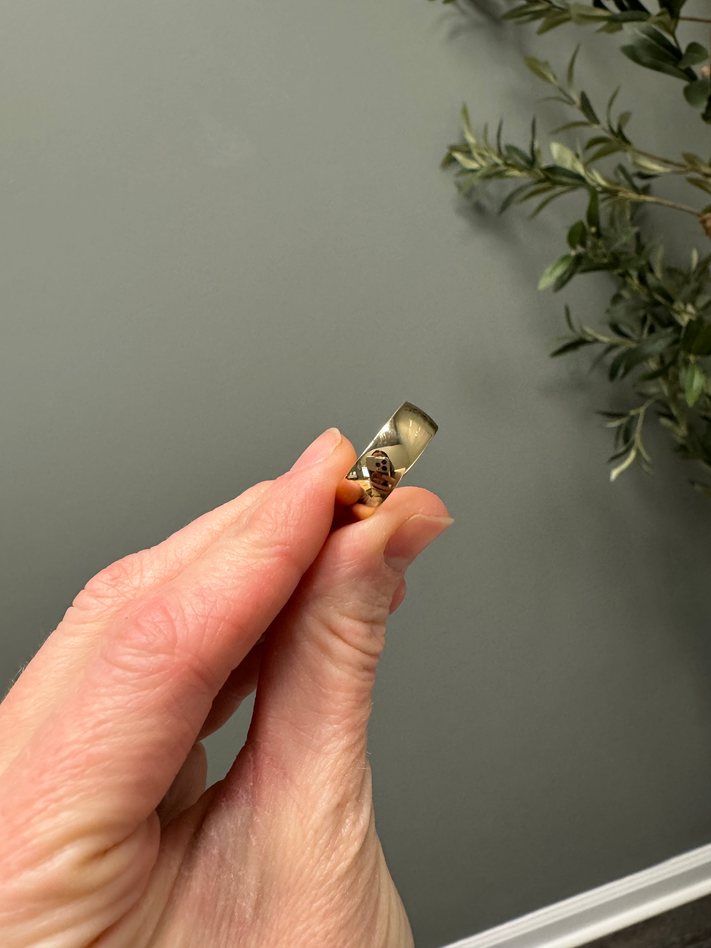 Polish 14k yellow gold, 7mm wide domed band