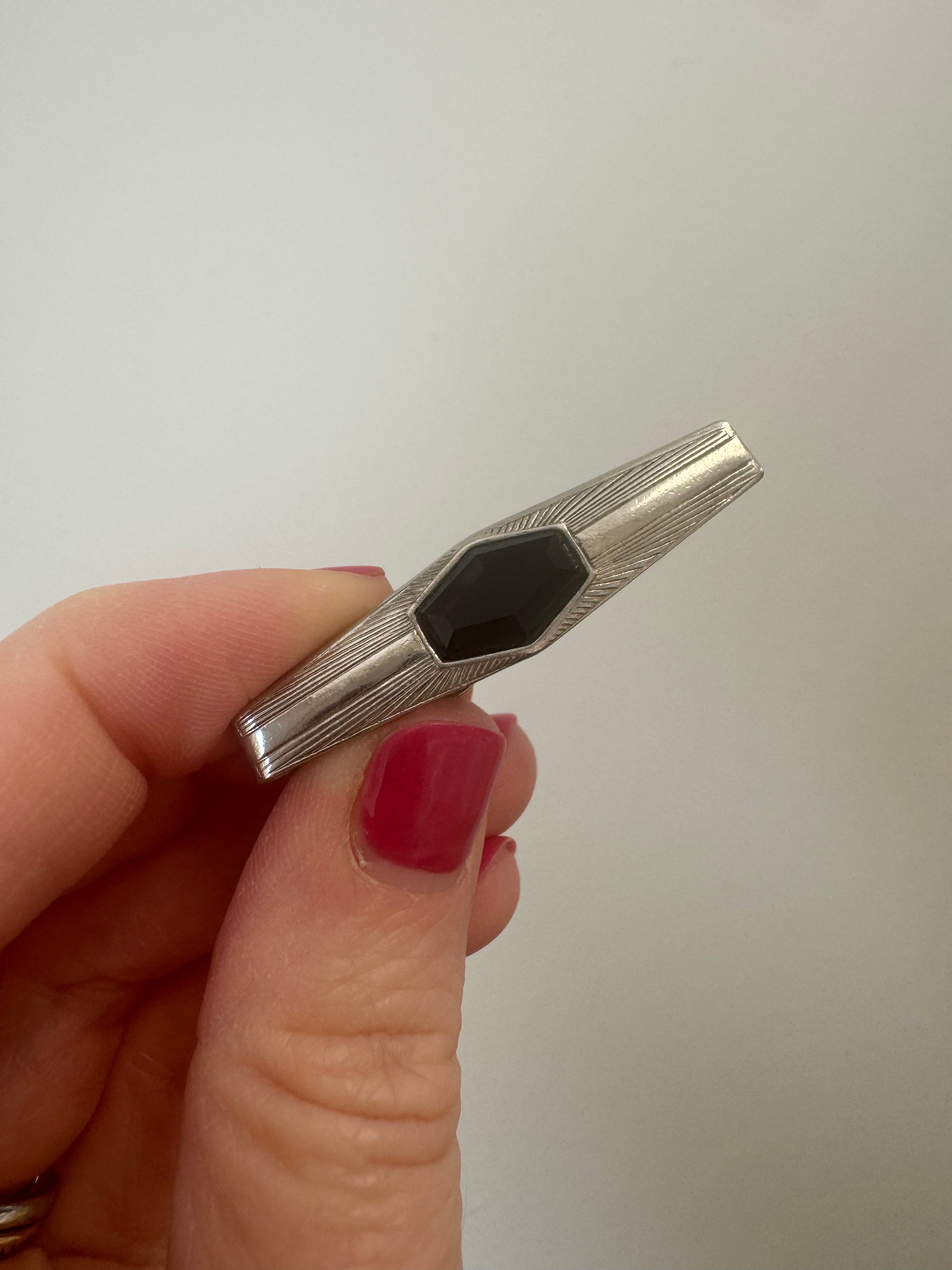 Tie Bar: Cut onyx stone to fit tie bar & add facets on top. Epoxy in place.