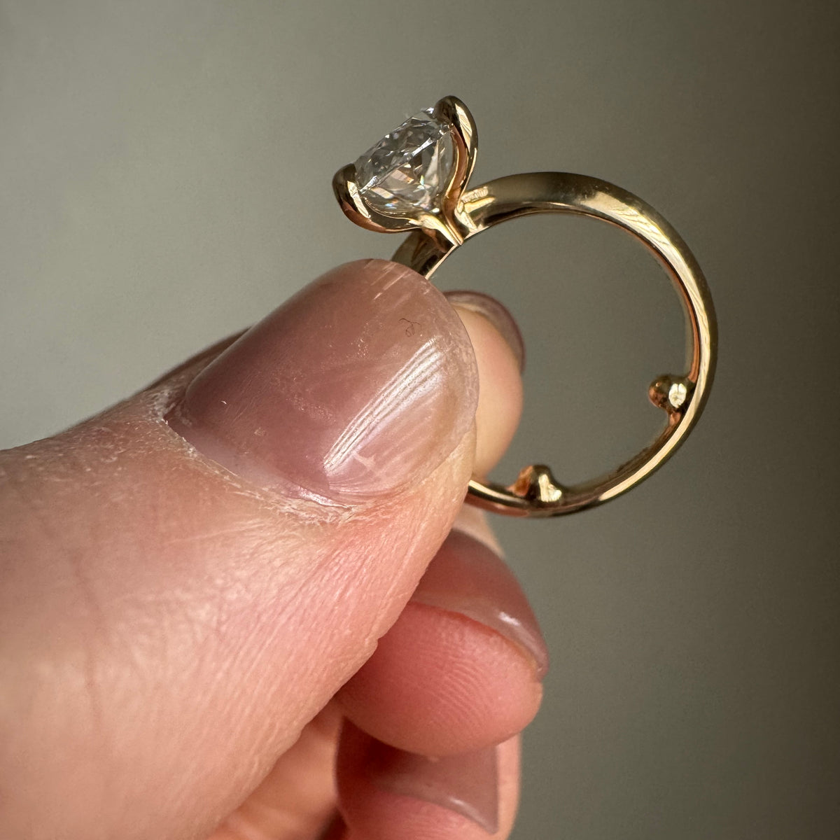 Add sizing beads to inside of 14k yellow gold engagement ring